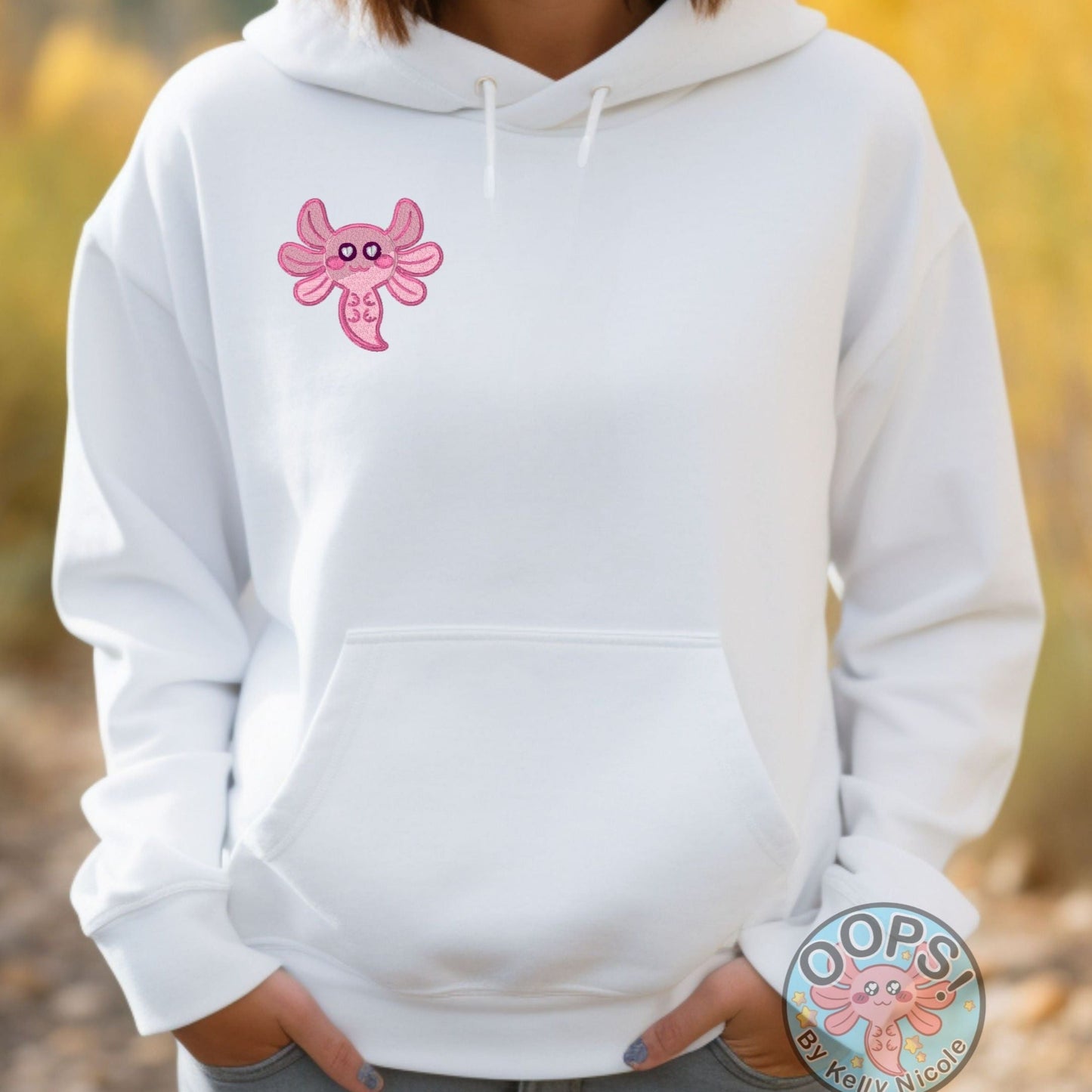 SPUD THE AXOLOTL in pink Embroidered Heavyweight Unisex Hoodie in WHITE.  Shop online today to get yours at HTTPS://OOPSBYKELLYNICOLE.COM 