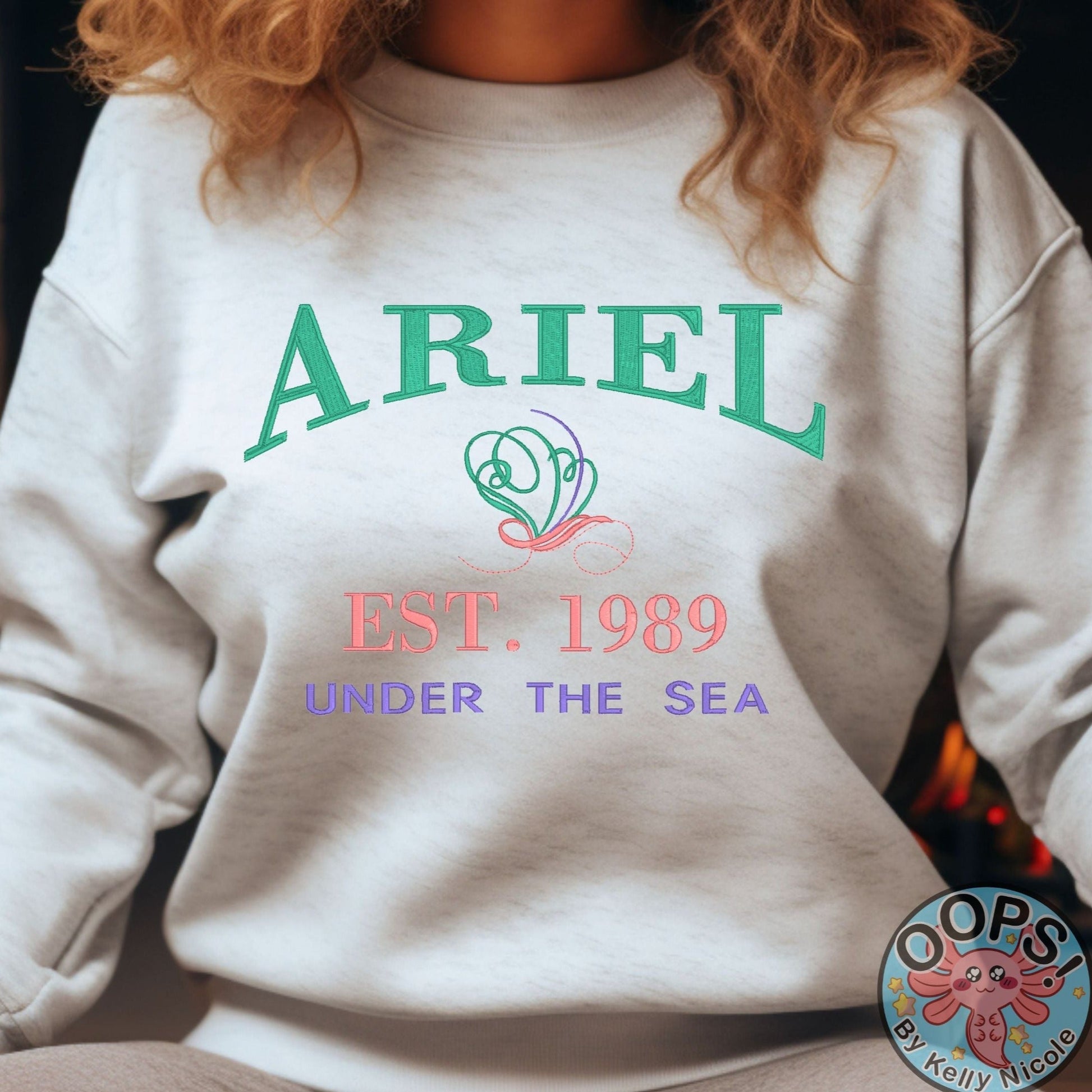 “ARIEL”  Disney Princess  Embroidered  Heavyweight Unisex Sweatshirt in ASH.  Shop online today to get yours at HTTPS://OOPSBYKELLYNICOLE.COM 