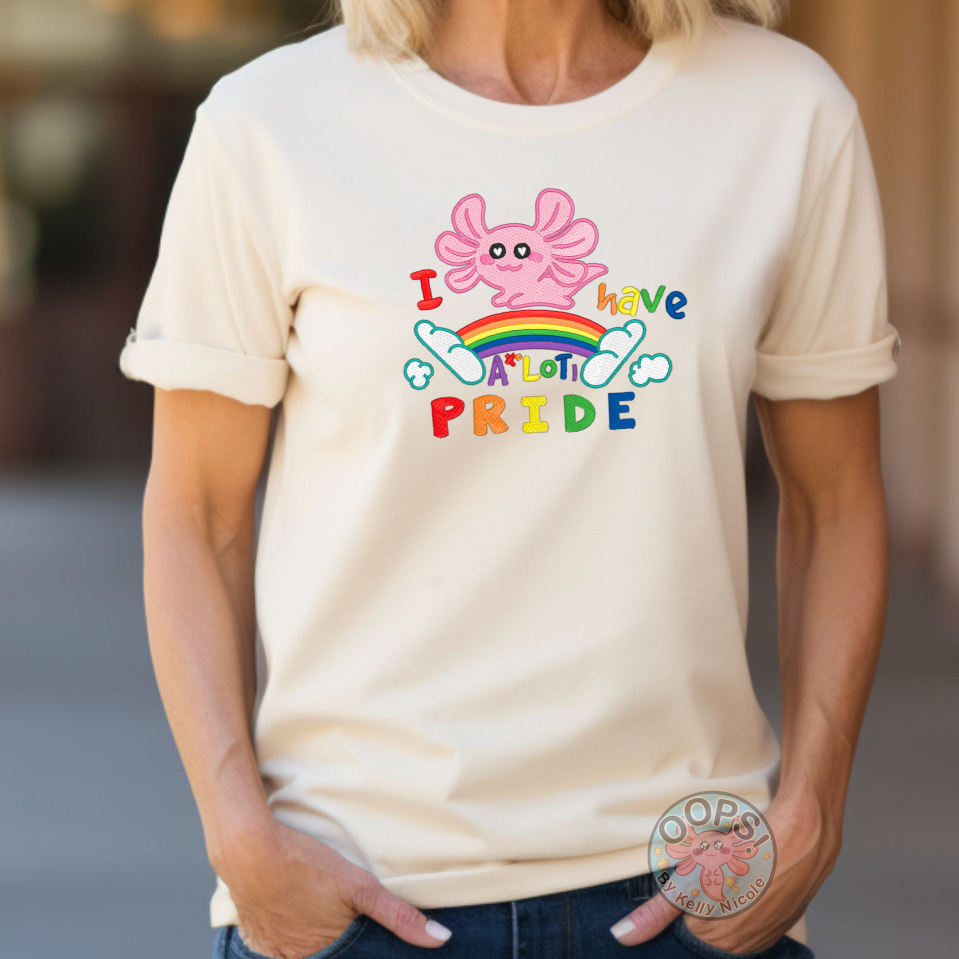 Embroidered "Axolotl PRIDE" Rainbow LGBTQIA+ Unisex Custom T-shirt in Ivory. Order yours today at https://oopsbykellynicole.com.