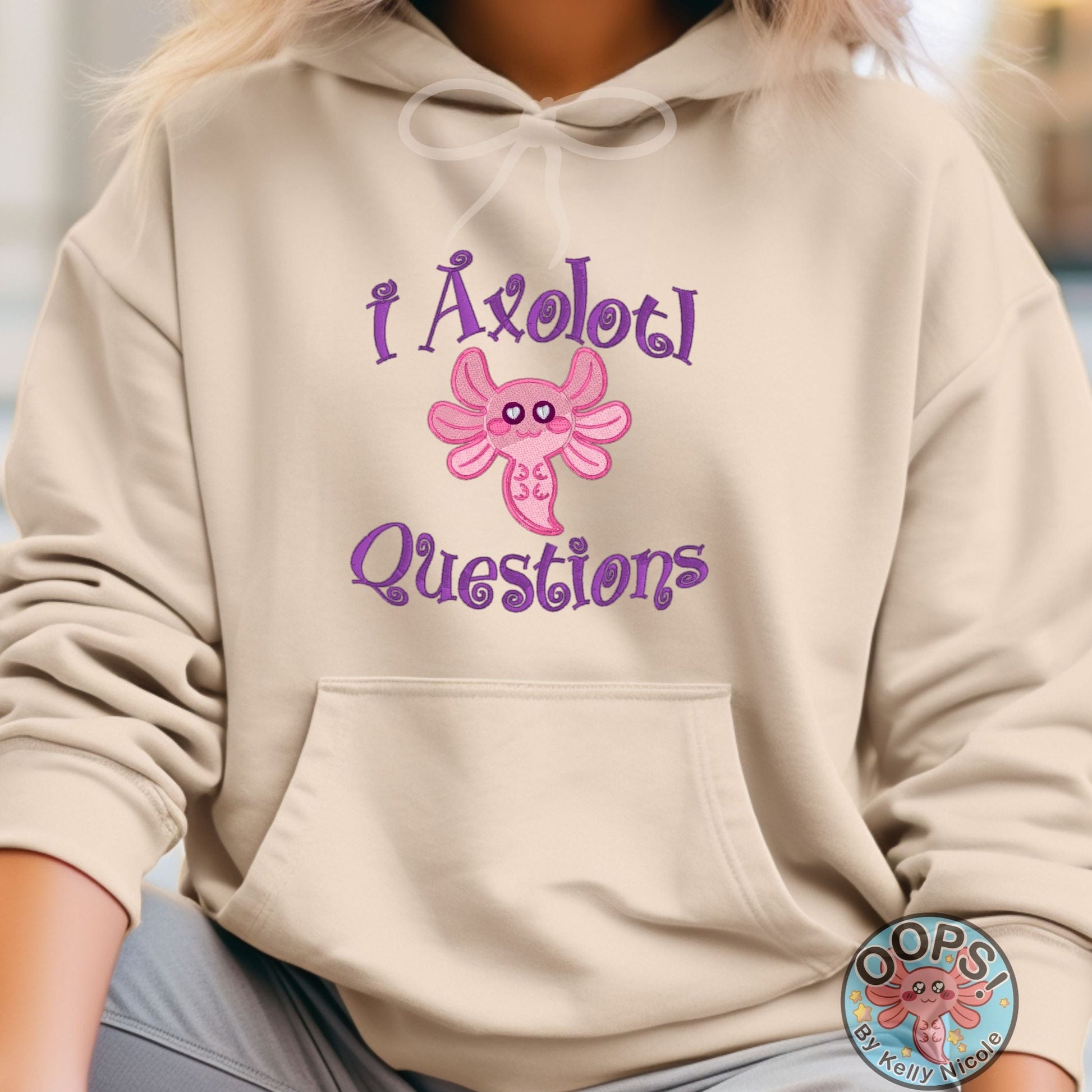  AXOLOTL QUESTIONS PINK AXOLOTL  Embroidered Heavyweight Unisex Hoodie in SAND.  Shop online today to get yours at HTTPS://OOPSBYKELLYNICOLE.COM 