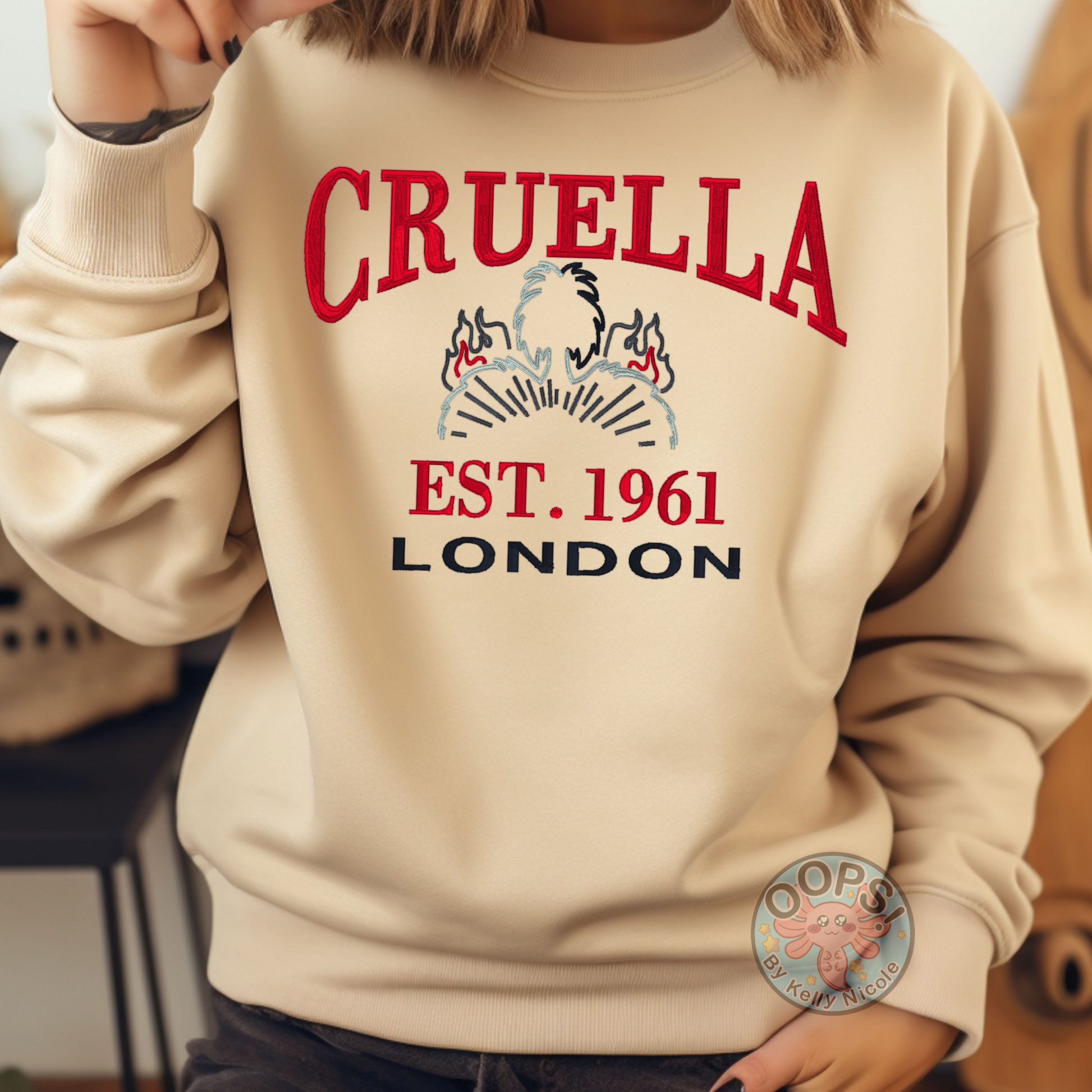 CRUELLA  Disney Villain Embroidered  Heavyweight Unisex Sweatshirt in SAND.  Shop online today to get yours at HTTPS://OOPSBYKELLYNICOLE.COM 