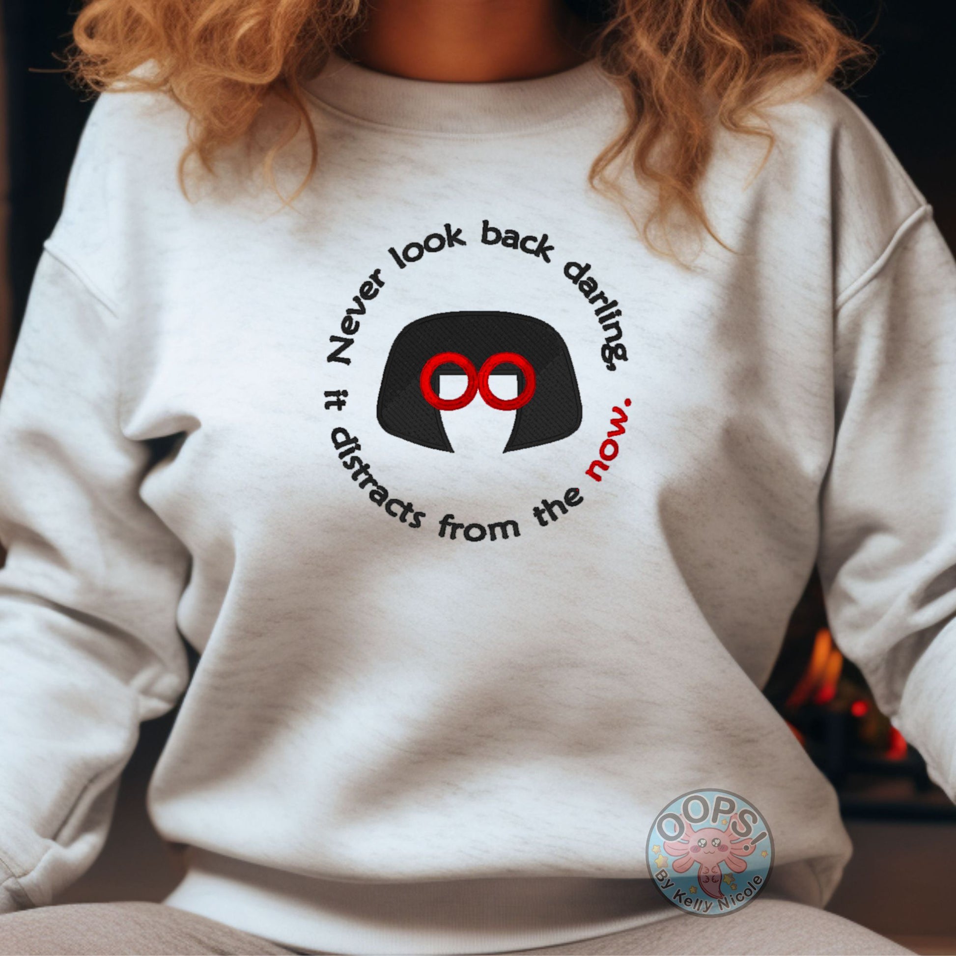 Embroidered "Never look back darling, it distracts from the Now" Edna-inspired Sweatshirt in Ash. Order yours today at https://oopsbykellynicole.com.