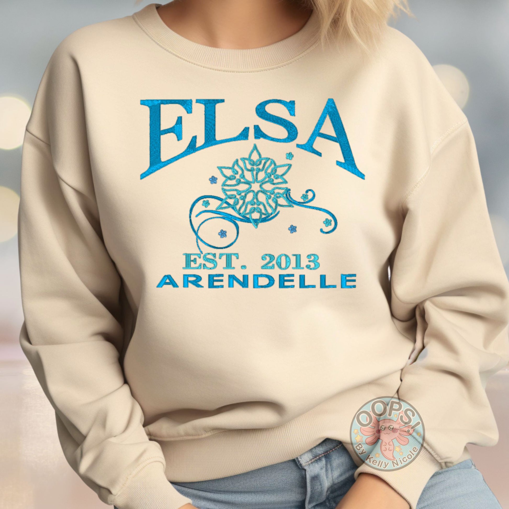 “Elsa” Disney Frozen Princess Embroidered Heavyweight Unisex Sweatshirt in Sand. Shop online today to get yours at HTTPS://OOPSBYKELLYNICOLE.COM