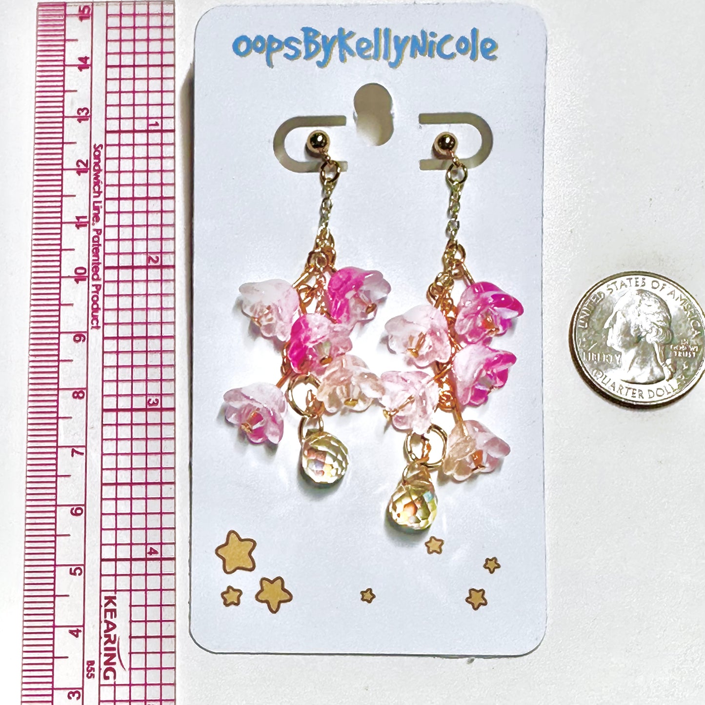 Wisteria Pink Blush  Floral Drop Earrings with Crystal dangle. Gold or Silver- Plated.  Lightweight, Hypoallergenic Statement posts. Its  seamlessly transitions from casual outings, Weddings and elegant events. Measurements  Shop online today to get yours at HTTPS://OOPSBYKELLYNICOLE.COM