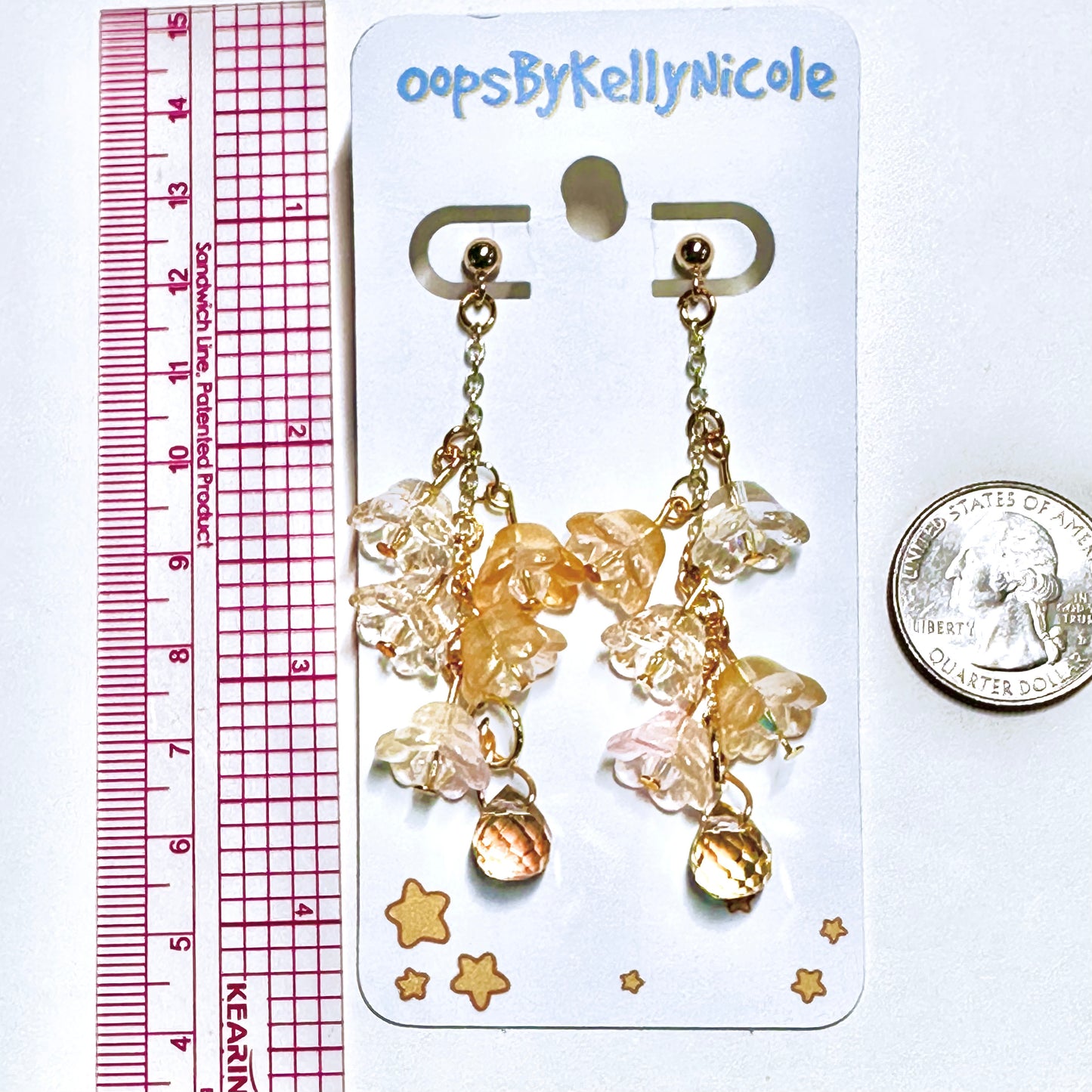 Wisteria Gold Blush  Floral Drop Earrings with Crystal dangle. Gold or Silver- Plated.  Lightweight, Hypoallergenic Statement posts. Its  seamlessly transitions from casual outings, Weddings and elegant events. Measurements  Shop online today to get yours at HTTPS://OOPSBYKELLYNICOLE.COM 