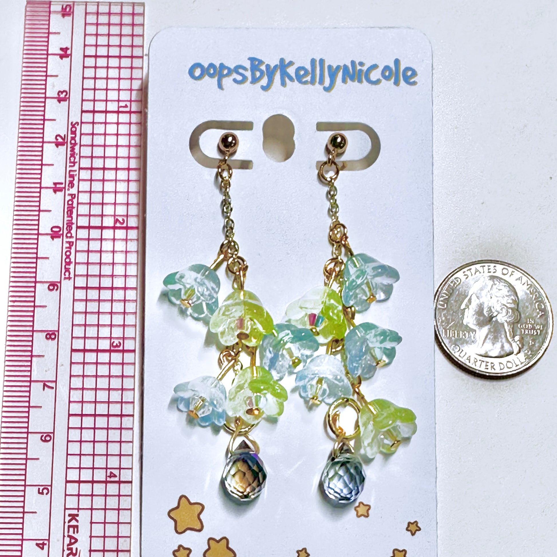 Wisteria Blue Green  Floral Drop Earrings with Crystal dangle. Gold or Silver- Plated.  Lightweight, Hypoallergenic Statement posts. Its  seamlessly transitions from casual outings, Weddings and elegant events. Measurement  Shop online today to get yours at HTTPS://OOPSBYKELLYNICOLE.COM 