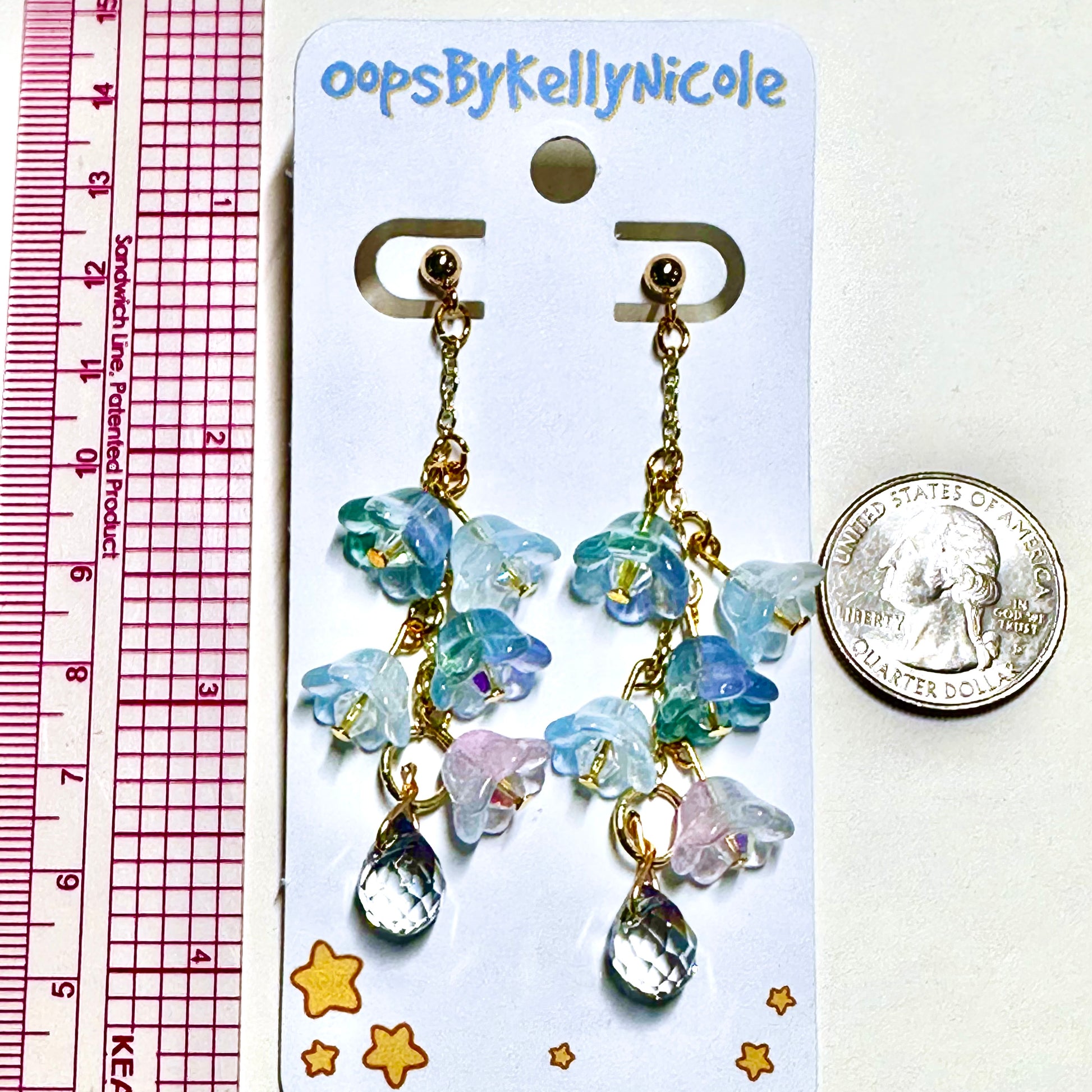 Wisteria  Blue Lilac Floral Drop Earrings with Crystal dangle. Gold or Silver- Plated.  Lightweight, Hypoallergenic Statement posts. Its  seamlessly transitions from casual outings, Weddings and elegant events. Measurements  Shop online today to get yours at HTTPS://OOPSBYKELLYNICOLE.COM