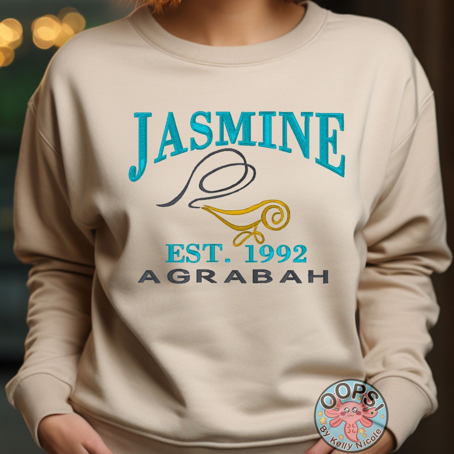 “J̌asmine”  Disney Princess  Embroidered  Heavyweight Unisex Sweatshirt in SAND.  Shop online today to get yours at HTTPS://OOPSBYKELLYNICOLE.COM 