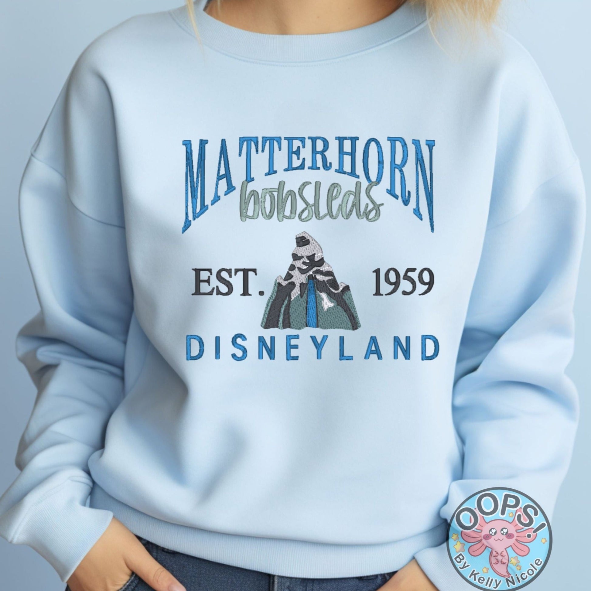 DISNEY “MATTERHORN” Theme Park Embroidered Heavyweight Unisex Sweatshirt in BLUE.  Shop online today to get yours at HTTPS://OOPSBYKELLYNICOLE.COM 