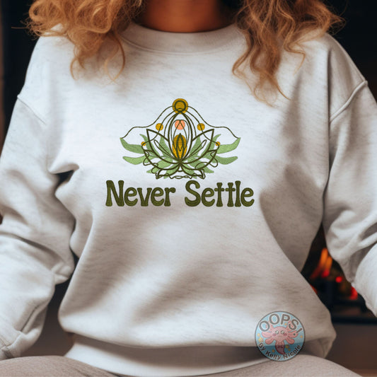 Embroidered “Never Settle” Ash Sweatshirt perfect for Home, work or anytime cozy comfort wear.  Order yours today at https://oopsbykellynicole.com.