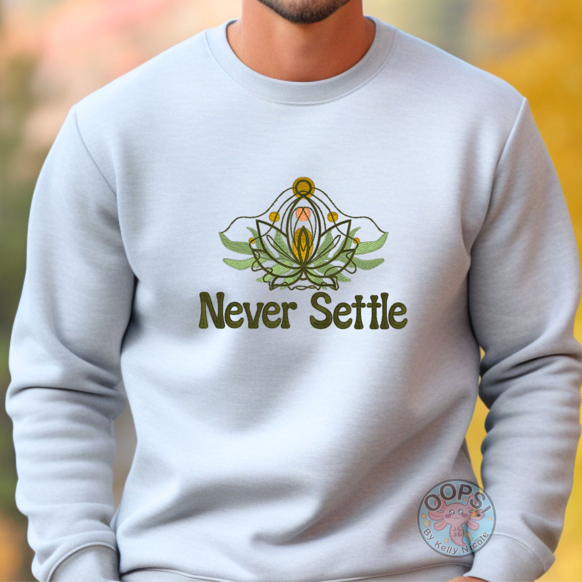 Embroidered “Never Settle” Ash Sweatshirt perfect for Home, work or anytime cozy comfort wear.  Order yours today at https://oopsbykellynicole.com.