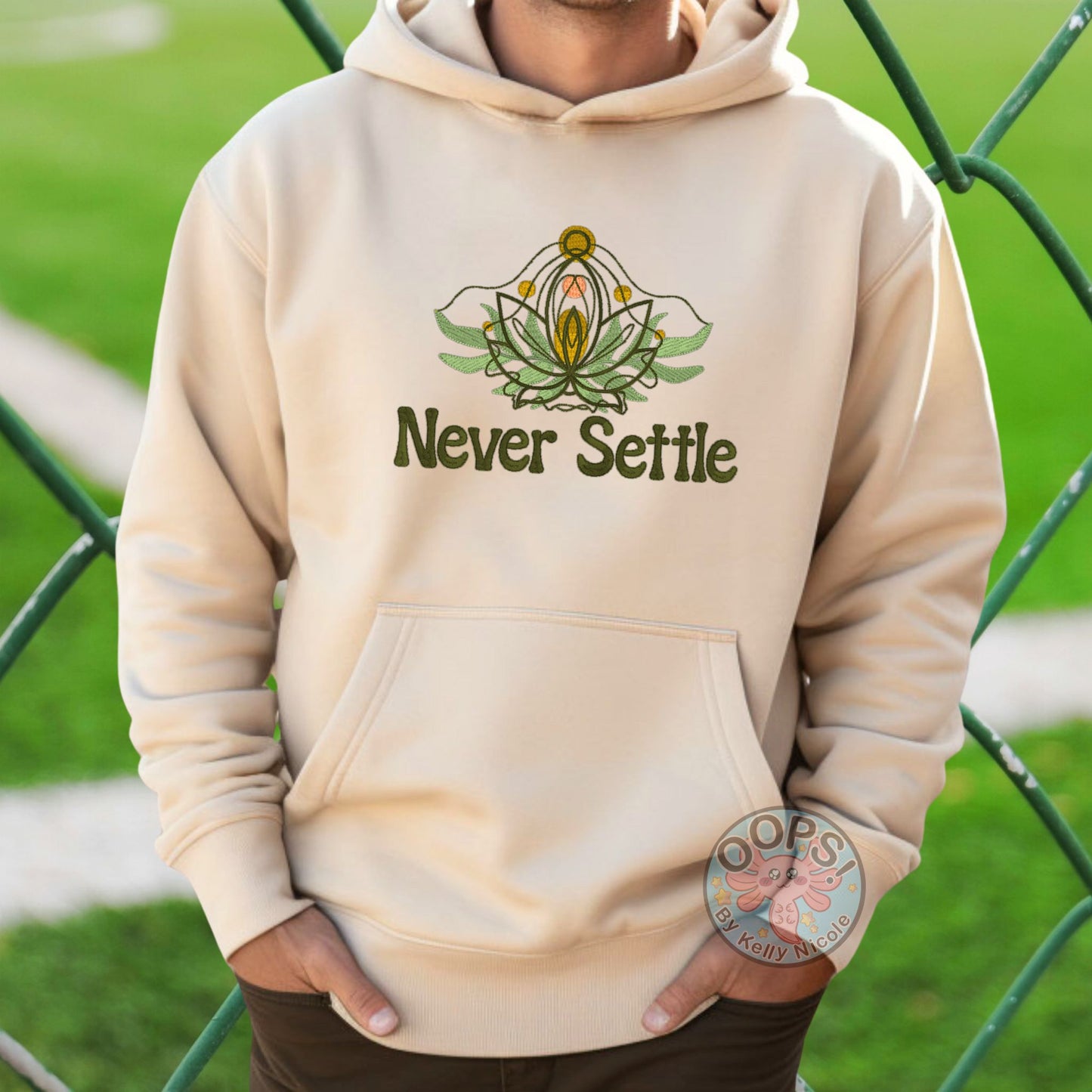 Embroidered “Never Settle” Sand Unisex Hoodie perfect for Home, work or anytime cozy comfort wear.  Order yours today at https://oopsbykellynicole.com.