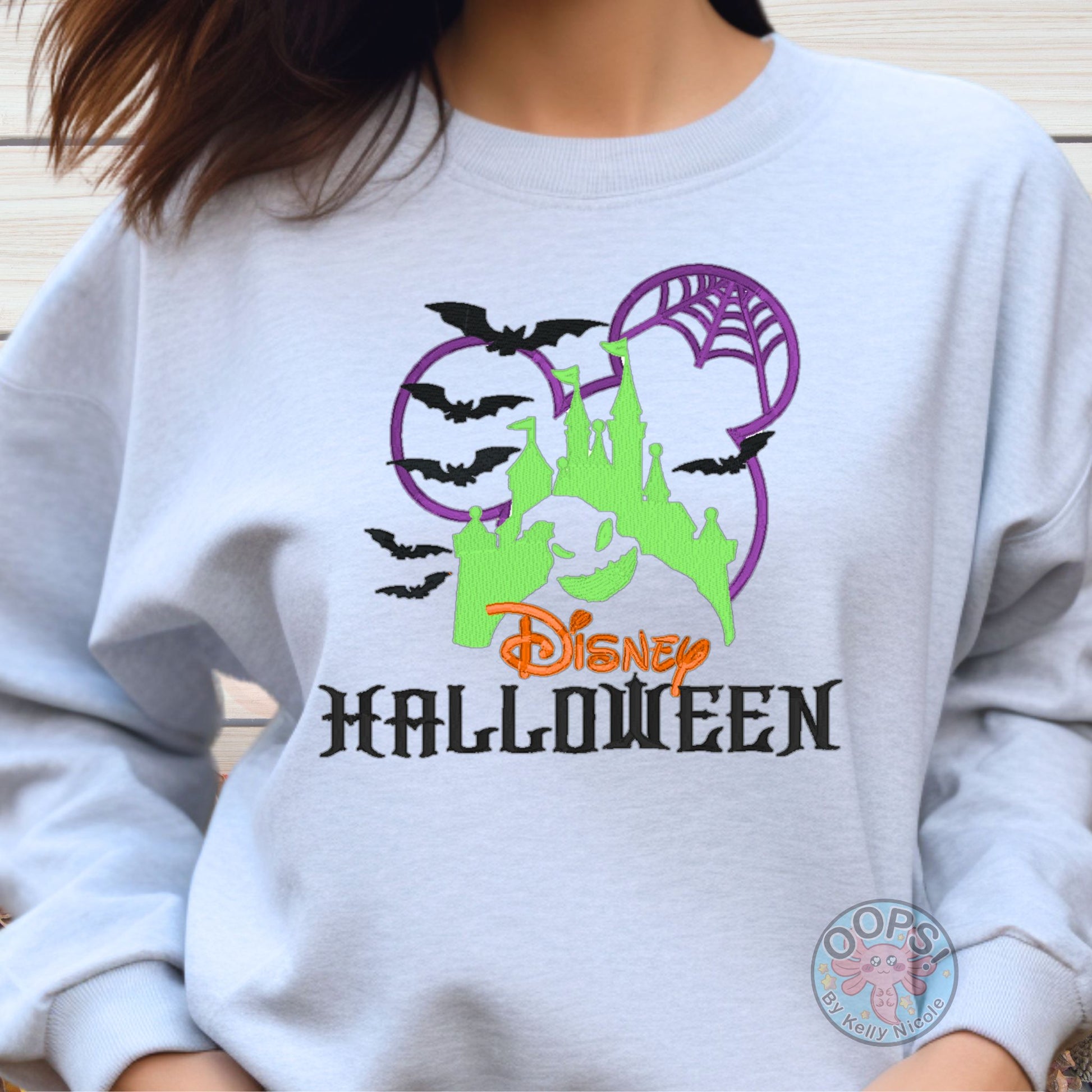 Embroidered DISNEY "Oogie Boogie" Nightmare Before Christmas Halloween Unisex Sweatshirt in Ash. Great for vacation or anytime Cozy comfort wear. Order yours today at HTTPS://OOPSBYKELLYNICOLE.COM