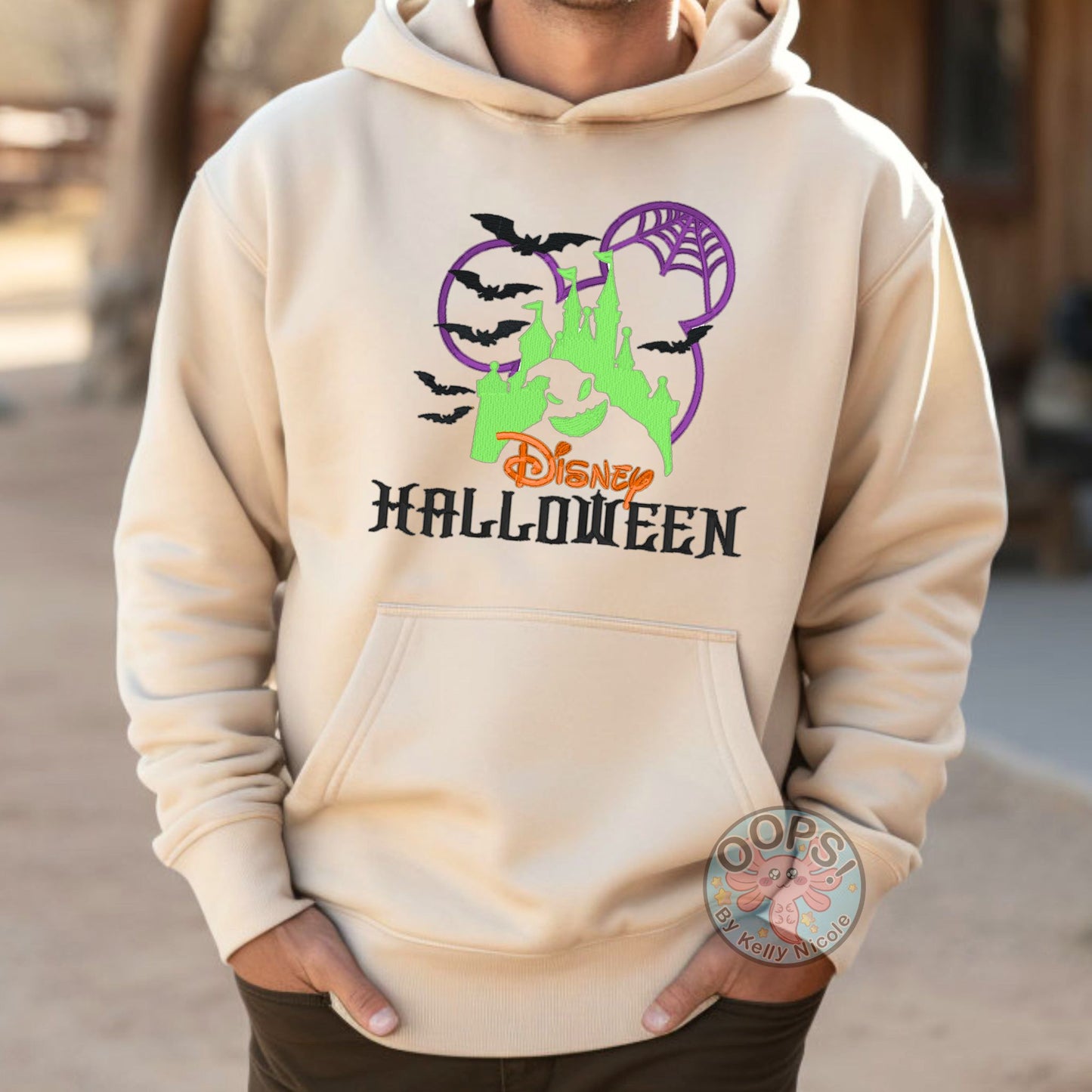 Embroidered DISNEY "Oogie Boogie" Nightmare Before Christmas Halloween Unisex Hoodie in Sand. Great for vacation or anytime Cozy comfort wear. Order yours today at HTTPS://OOPSBYKELLYNICOLE.COM