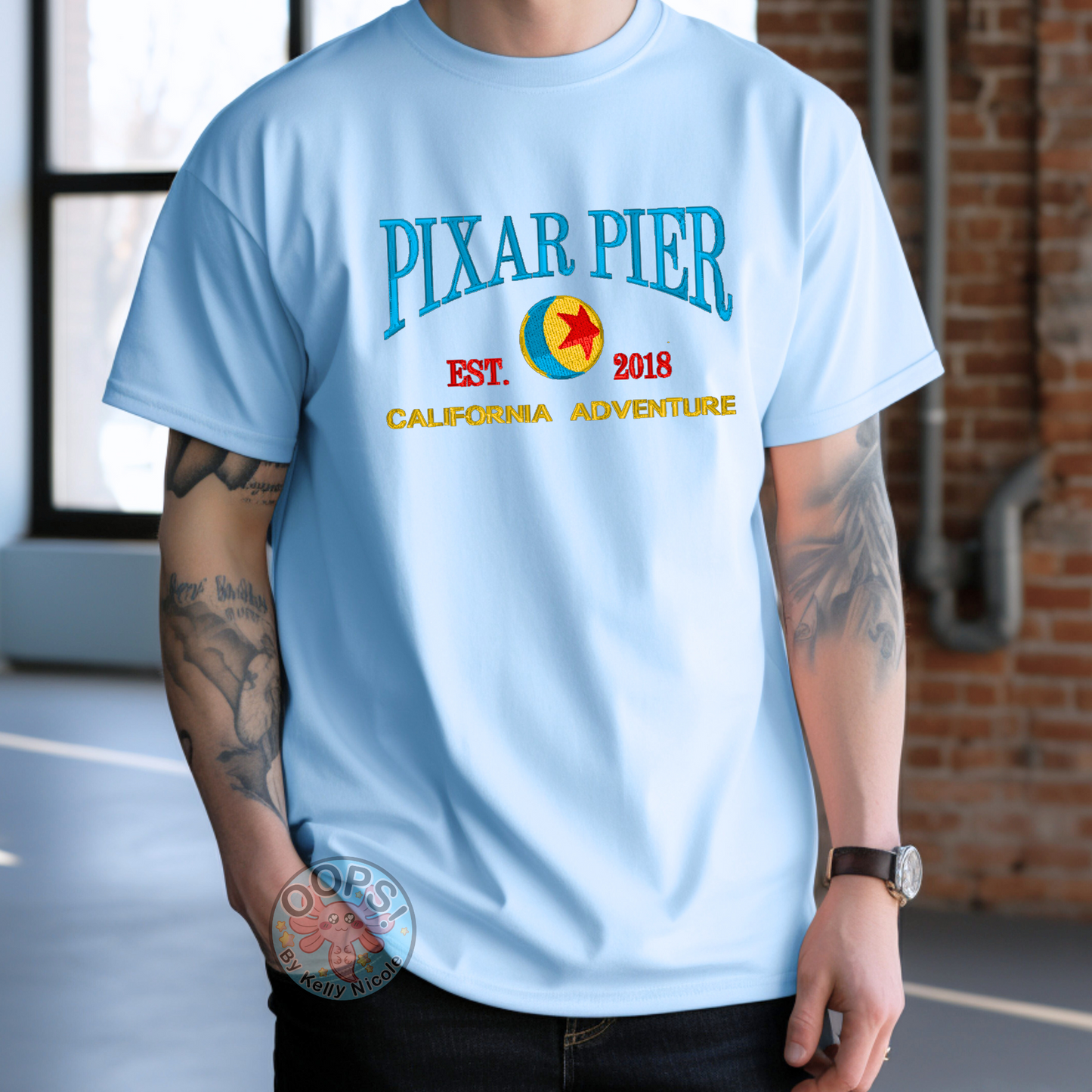 Embroidered Disney “Pixar Pier” DCA inspired  Unisex ComfortColors T-shirt in Blue. Perfect for Home, work or anytime cozy comfort wear.  Order yours today at https://oopsbykellynicole.com.