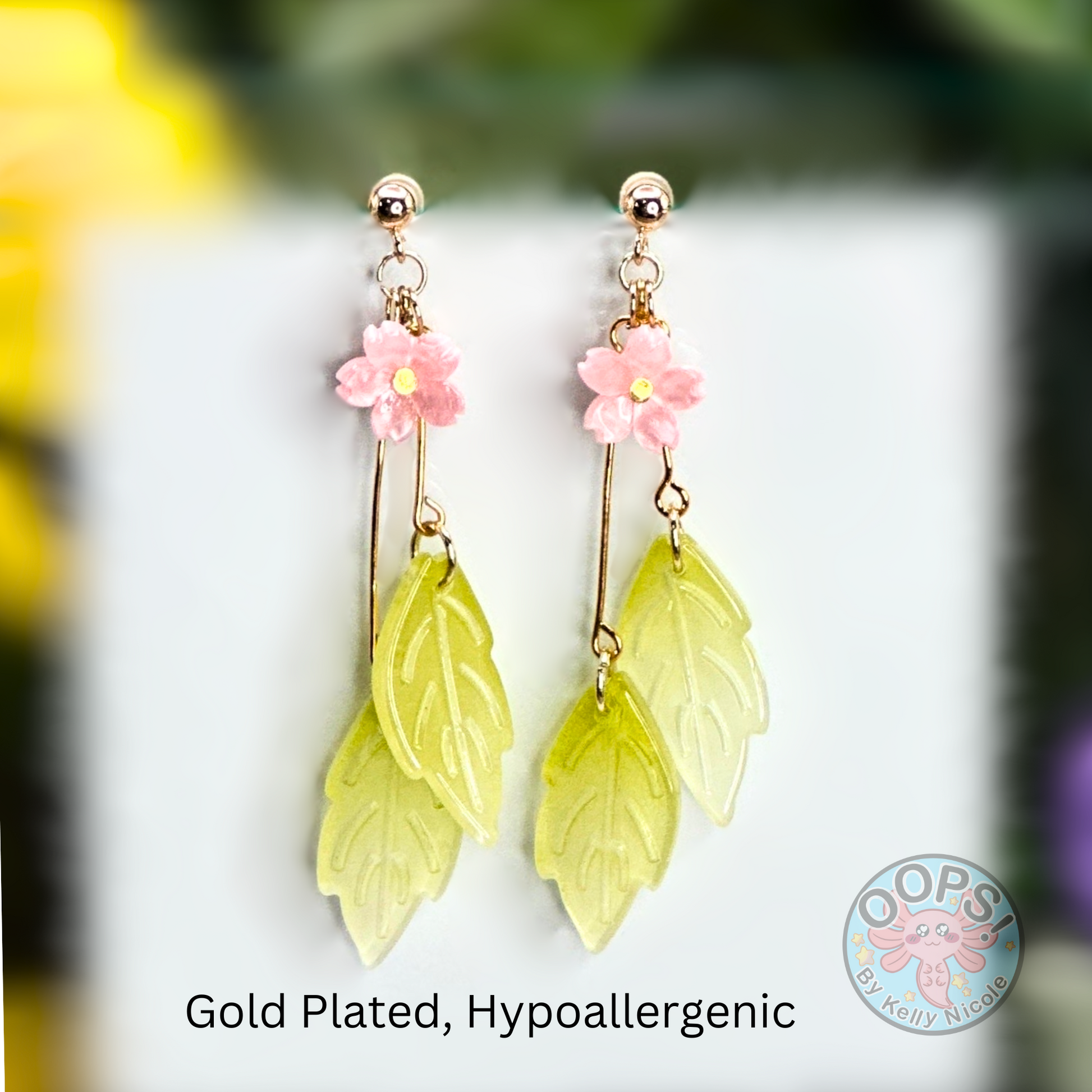 Sakura Pink Cherry Blossom earrings with elegant green leaf Drops with Gold-plated hypoallergenic posts. Lightweight and  perfect for home, work, party or memorable Gift.002 Shop online today to get yours at HTTPS://OOPSBYKELLYNICOLE.COM