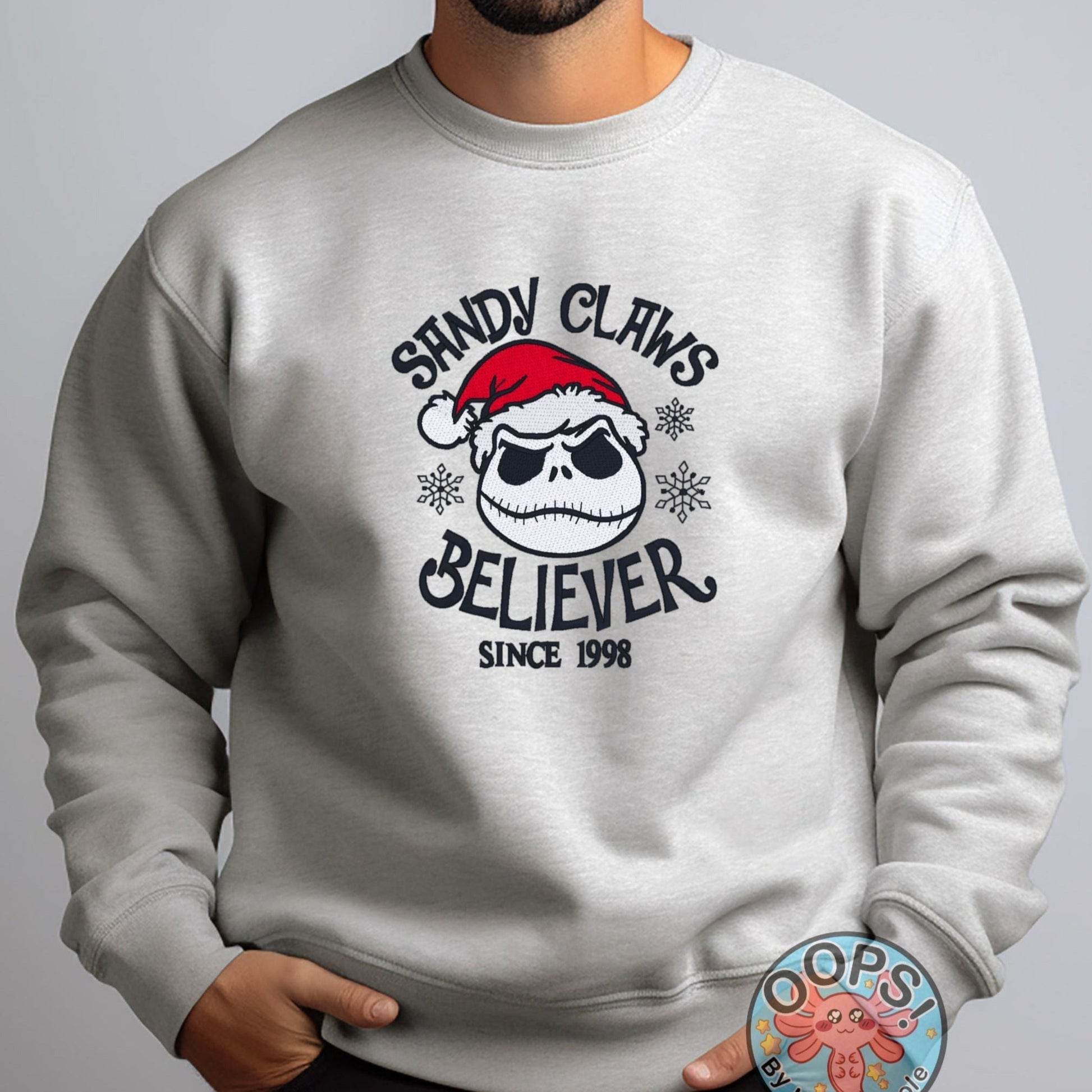 Jack Skellington, Nightmare Before Christmas, "Sandy Claus Believer"  Embroidered Heavyweight Unisex Sweatshirt in ASH  Shop online today to get yours at HTTPS://OOPSBYKELLYNICOLE.COM 