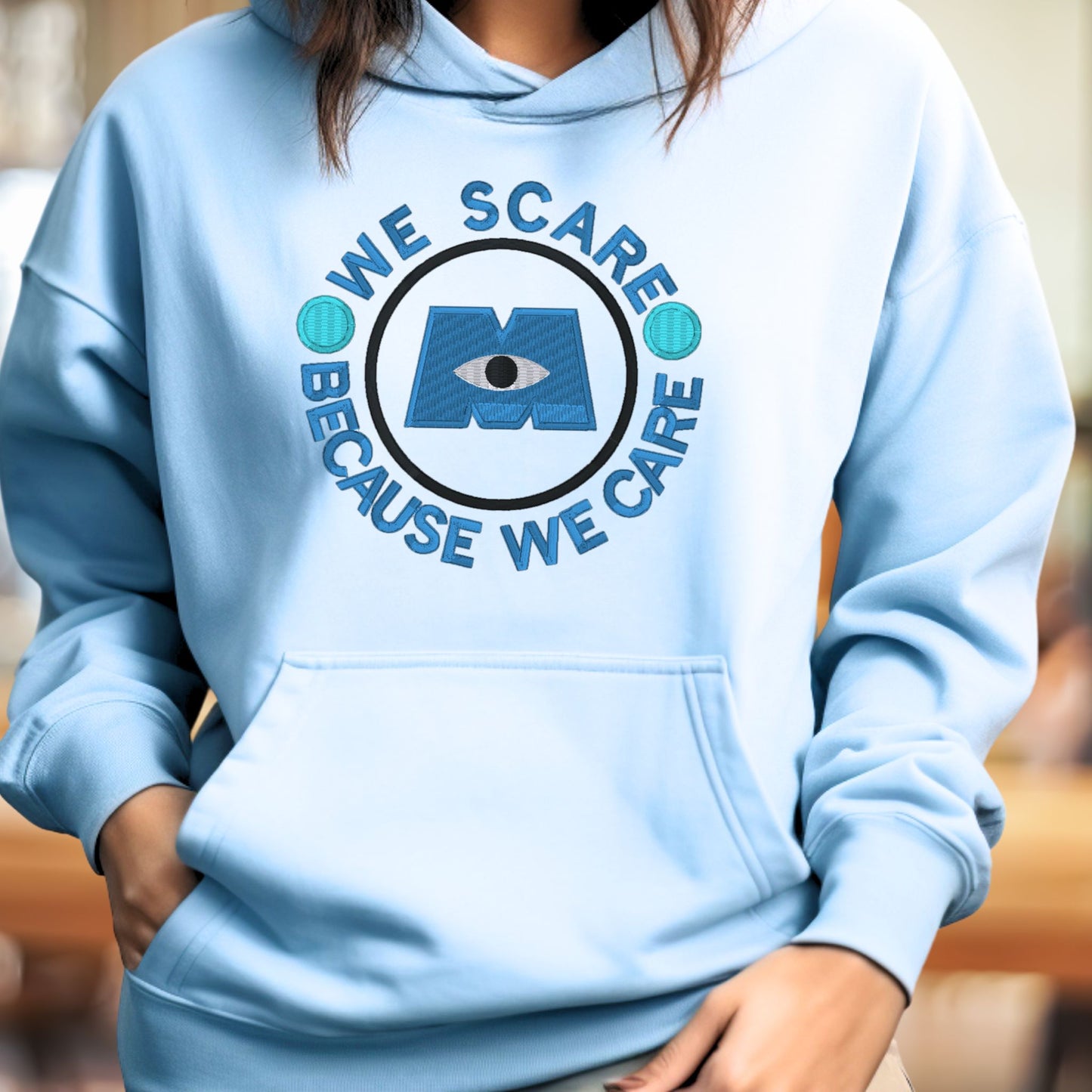 Embroidered Monster's Inc "We Scare because We Care" Unisex Pullover