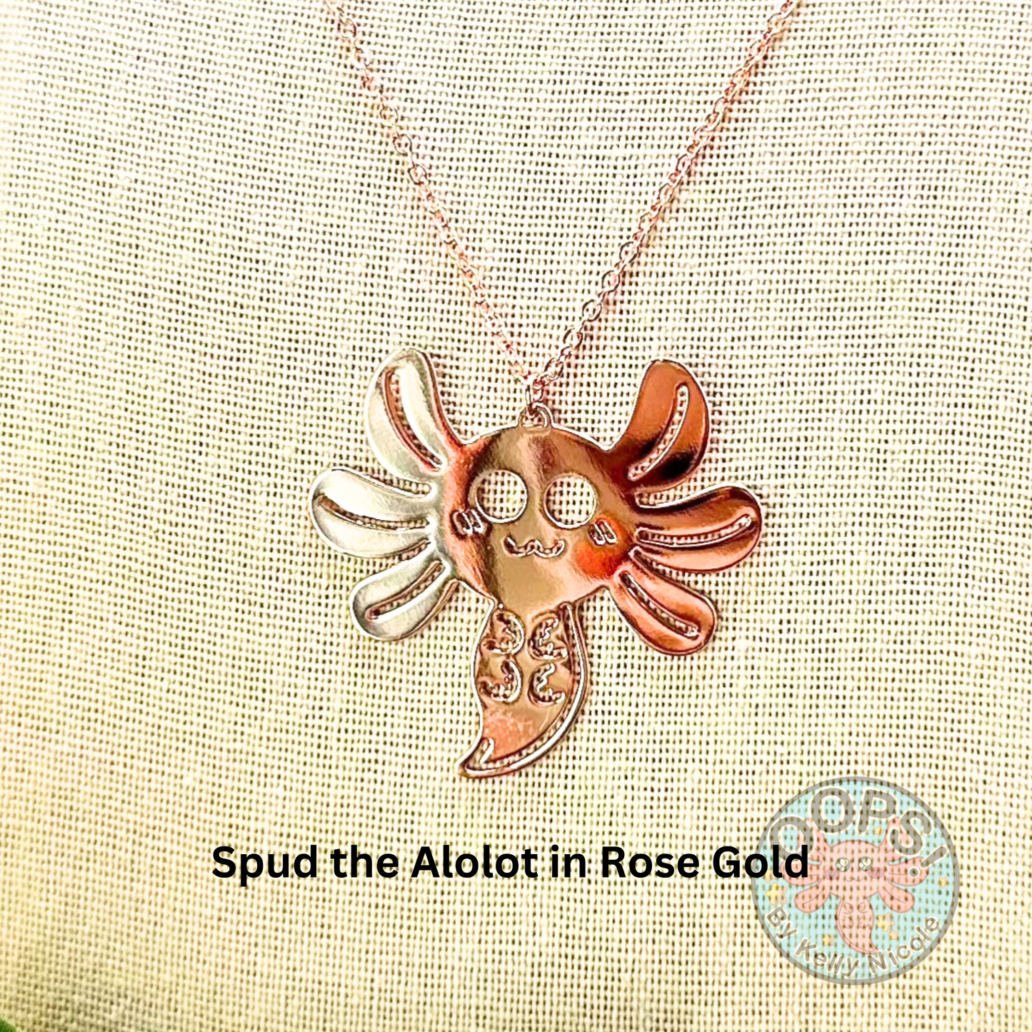 Sparkling Rose Gold Axolotl Pendant will dress up any outfit. A beautiful yet subtle design that can go anywhere! This stunning pendant is memorable and will sparkle under any light.