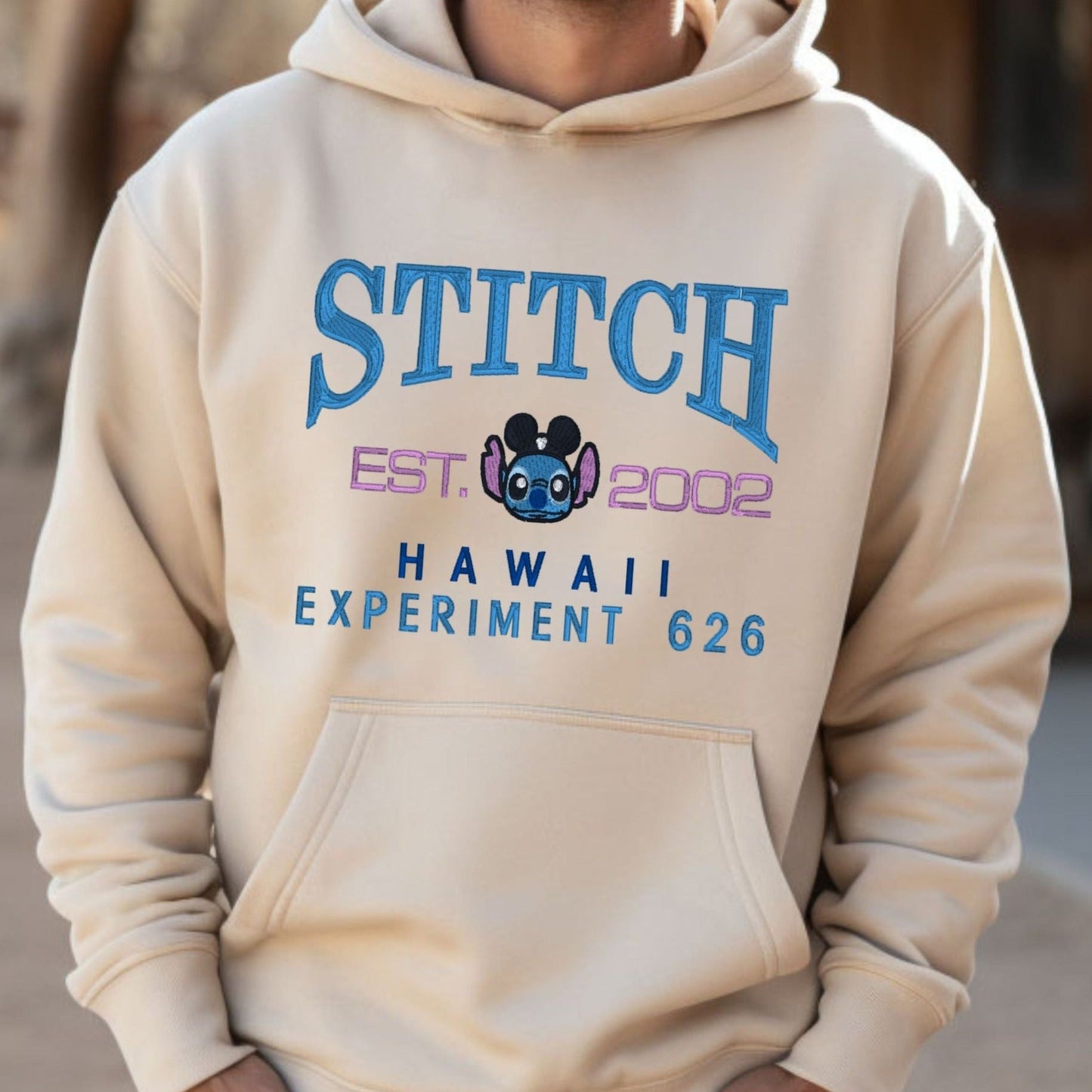 STITCH Alien Shirt from Disney’s Lilo and Stitch      Embroidered Heavyweight Unisex Hoodie in SAND.  Shop online today to get yours at HTTPS://OOPSBYKELLYNICOLE.COM 