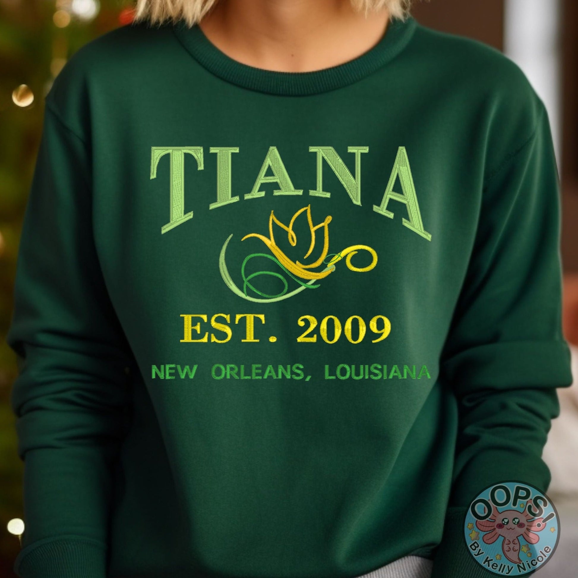 TIANA Disney Princess Embroidered  Heavyweight Unisex Sweatshirt in GREEN.  Shop online today to get yours at HTTPS://OOPSBYKELLYNICOLE.COM 