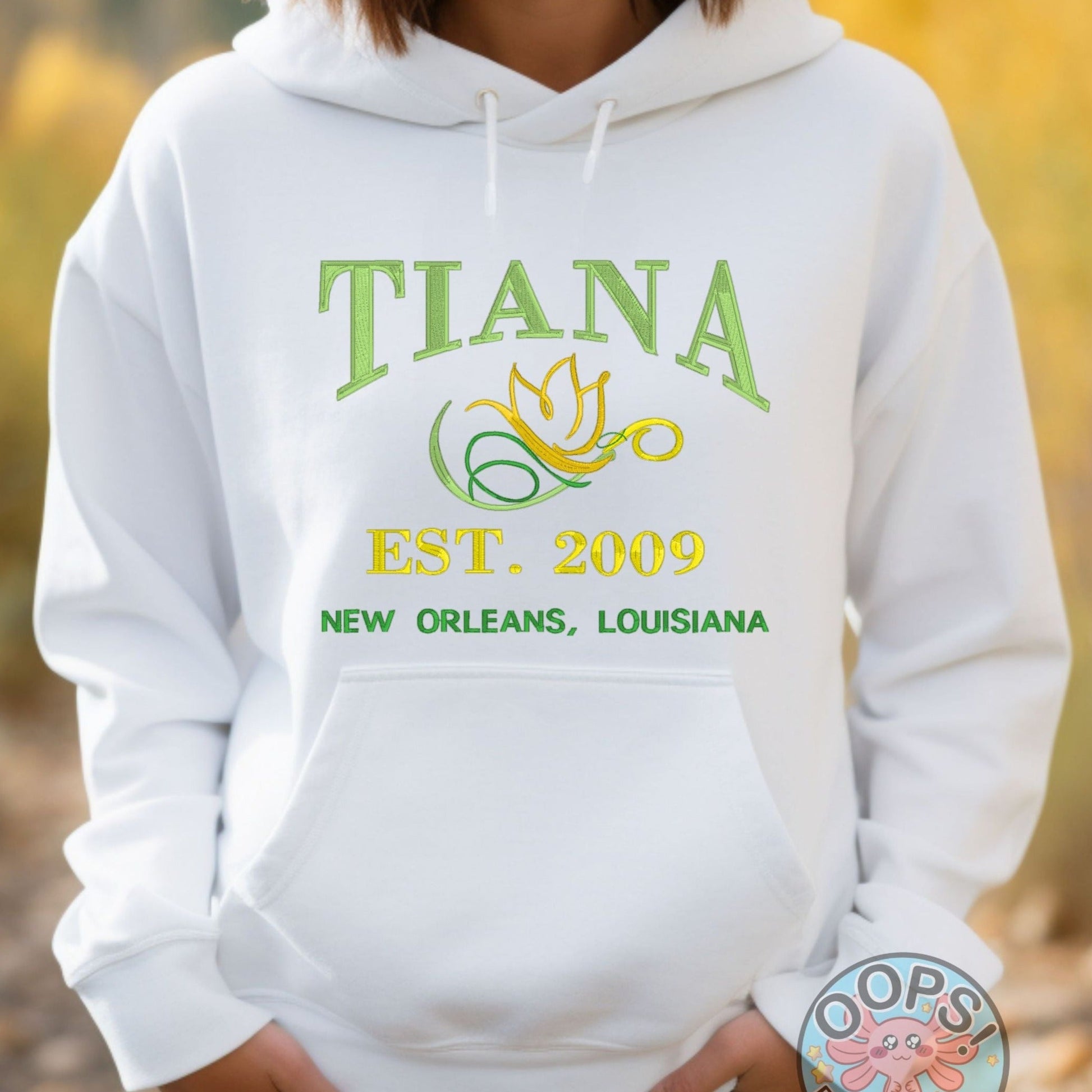 TIANA Disney Princess Embroidered Heavyweight Unisex Hoodie in WHITE.  Shop online today to get yours at HTTPS://OOPSBYKELLYNICOLE.COM 