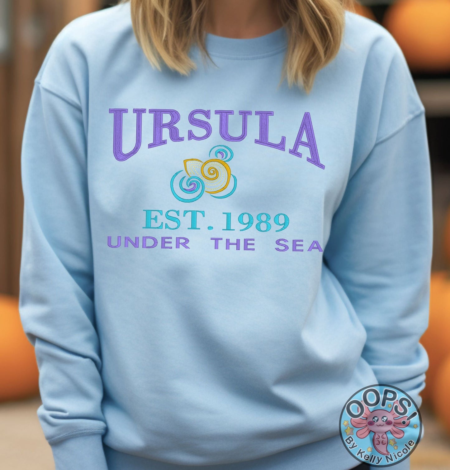 URSULA  Disney Villain Embroidered  Heavyweight Unisex Sweatshirt in BLUE.  Shop online today to get yours at HTTPS://OOPSBYKELLYNICOLE.COM