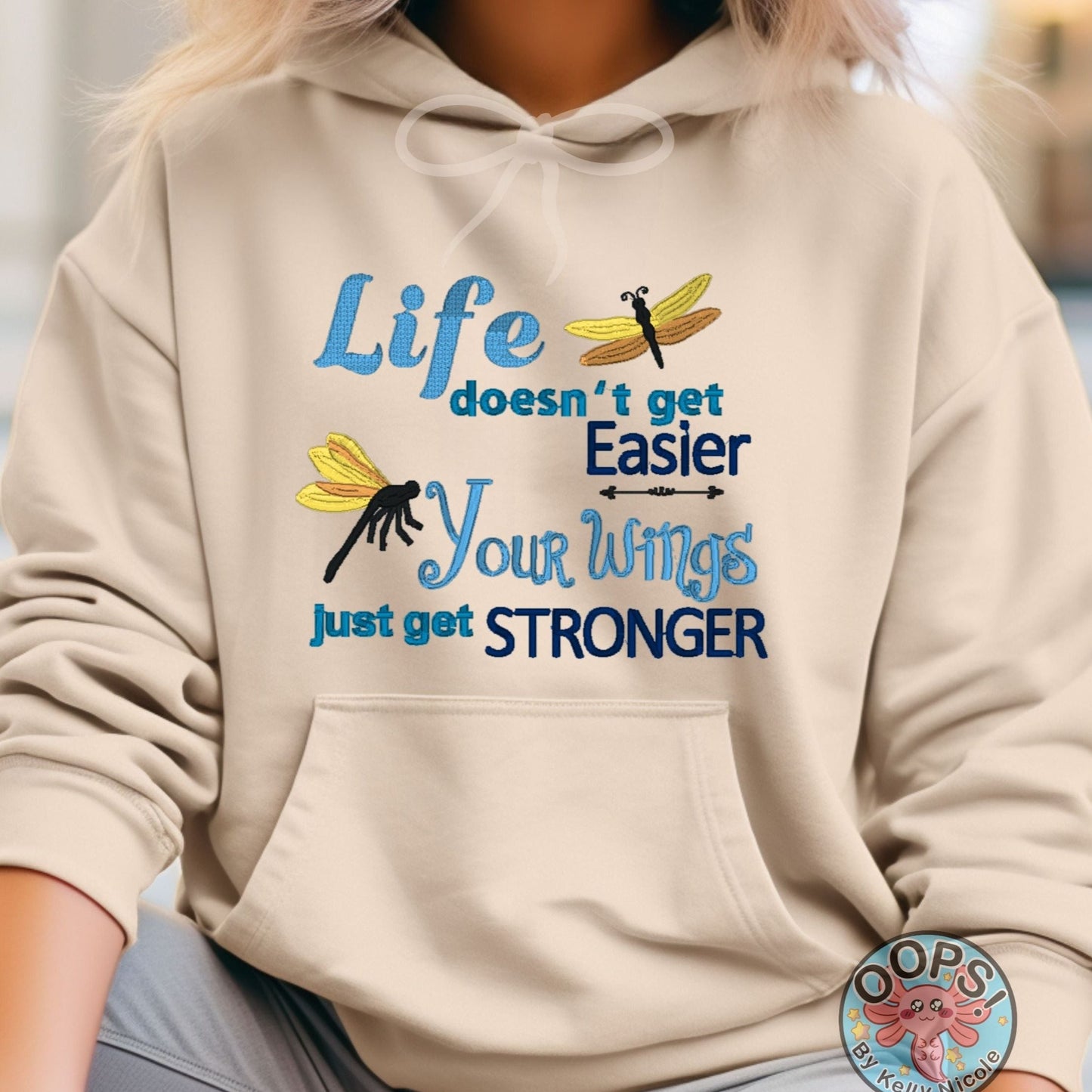  "LIFE DOESN'T GET EASIER, YOUR WINGS GET STRONGER". Inspirational Inspirational Embroidered Heavyweight Unisex Hoodie in SAND.  Shop online today to get yours at HTTPS://OOPSBYKELLYNICOLE.COM 