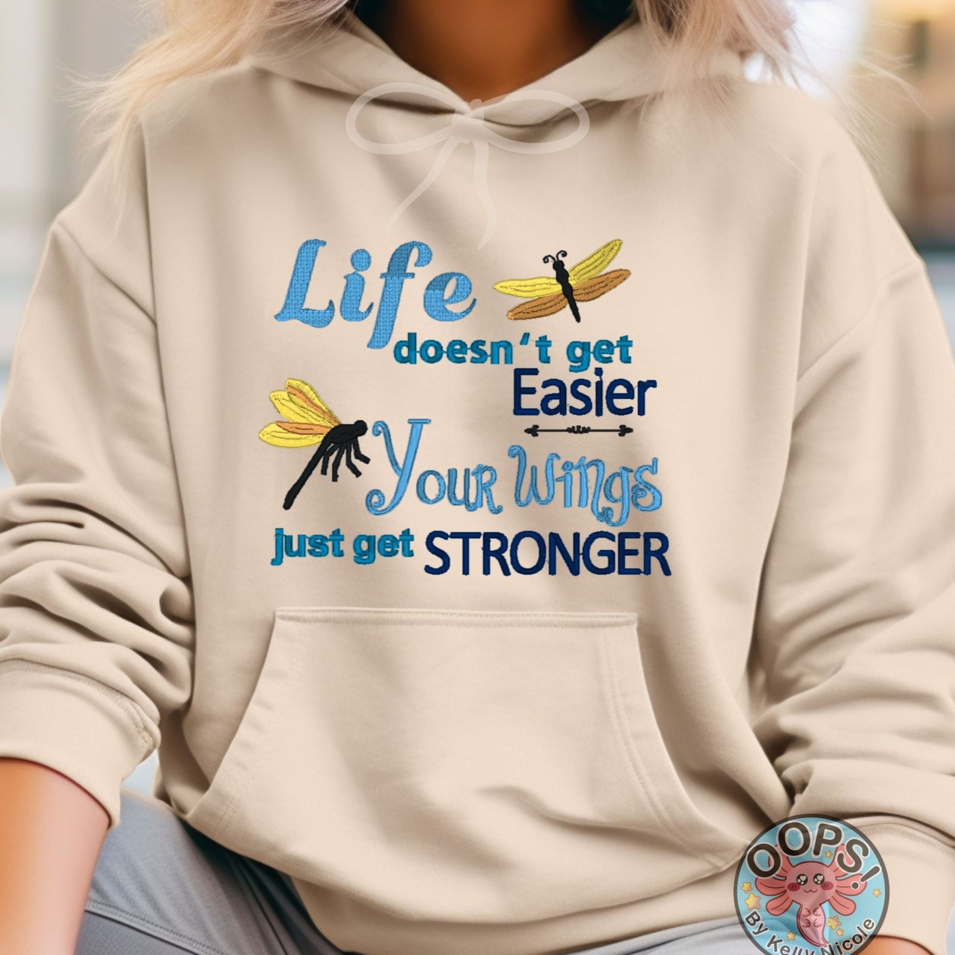  "LIFE DOESN'T GET EASIER, YOUR WINGS GET STRONGER". Inspirational Inspirational Embroidered Heavyweight Unisex Hoodie in SAND.  Shop online today to get yours at HTTPS://OOPSBYKELLYNICOLE.COM 