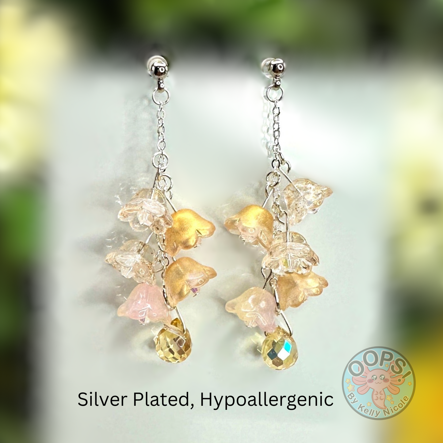 Wisteria Gold Blush  Floral Drop Earrings with Crystal dangle. Silver-Plated.  Lightweight, Hypoallergenic Statement posts. Its  seamlessly transitions from casual outings, Weddings and elegant events. 003 Shop online today to get yours at HTTPS://OOPSBYKELLYNICOLE.COM