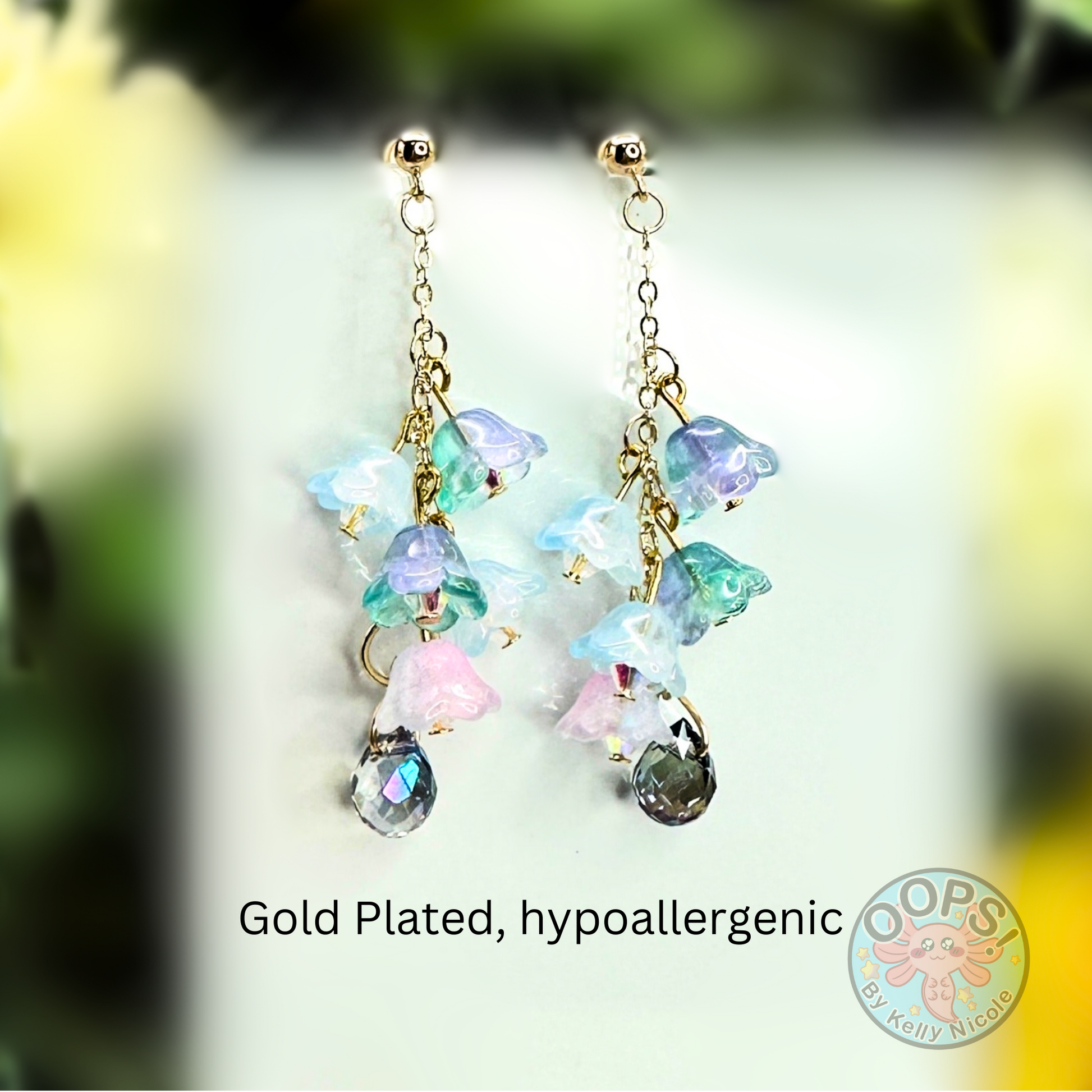 Wisteria Blue Lilac Floral Drop Earrings with Crystal dangle. Gold-Plated.  Lightweight, Hypoallergenic Statement posts. Its  seamlessly transitions from casual outings, Weddings and elegant events. 003 Shop online today to get yours at HTTPS://OOPSBYKELLYNICOLE.COM 