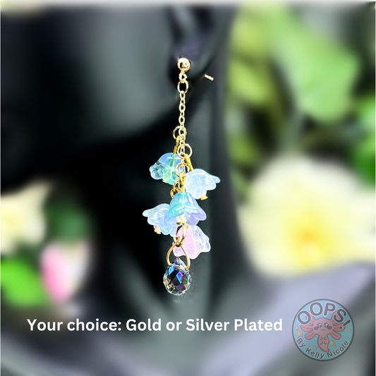 Wisteria Blue Lilac Floral Drop Earrings with Crystal dangle. Gold or Silver- Plated.  Lightweight, Hypoallergenic Statement posts. Its  seamlessly transitions from casual outings, Weddings and elegant events.  Shop online today to get yours at HTTPS://OOPSBYKELLYNICOLE.COM 