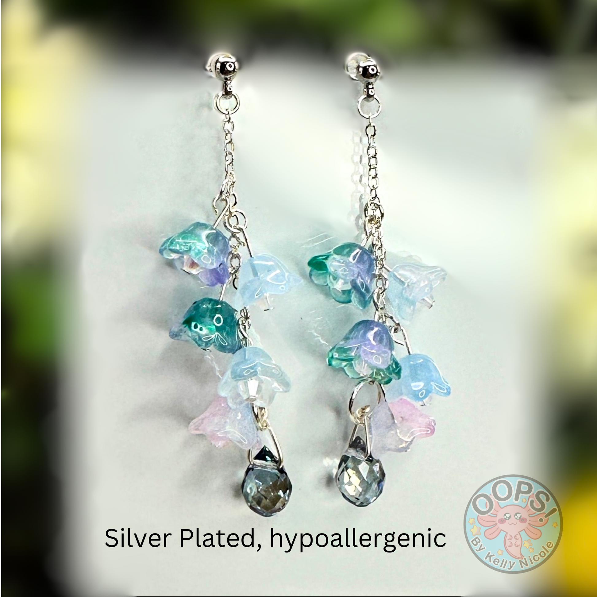 Wisteria Blue Lilac  Floral Drop Earrings with Crystal dangle. Silver-Plated.  Lightweight, Hypoallergenic Statement posts. Its  seamlessly transitions from casual outings, Weddings and elegant events. 003 Shop online today to get yours at HTTPS://OOPSBYKELLYNICOLE.COM