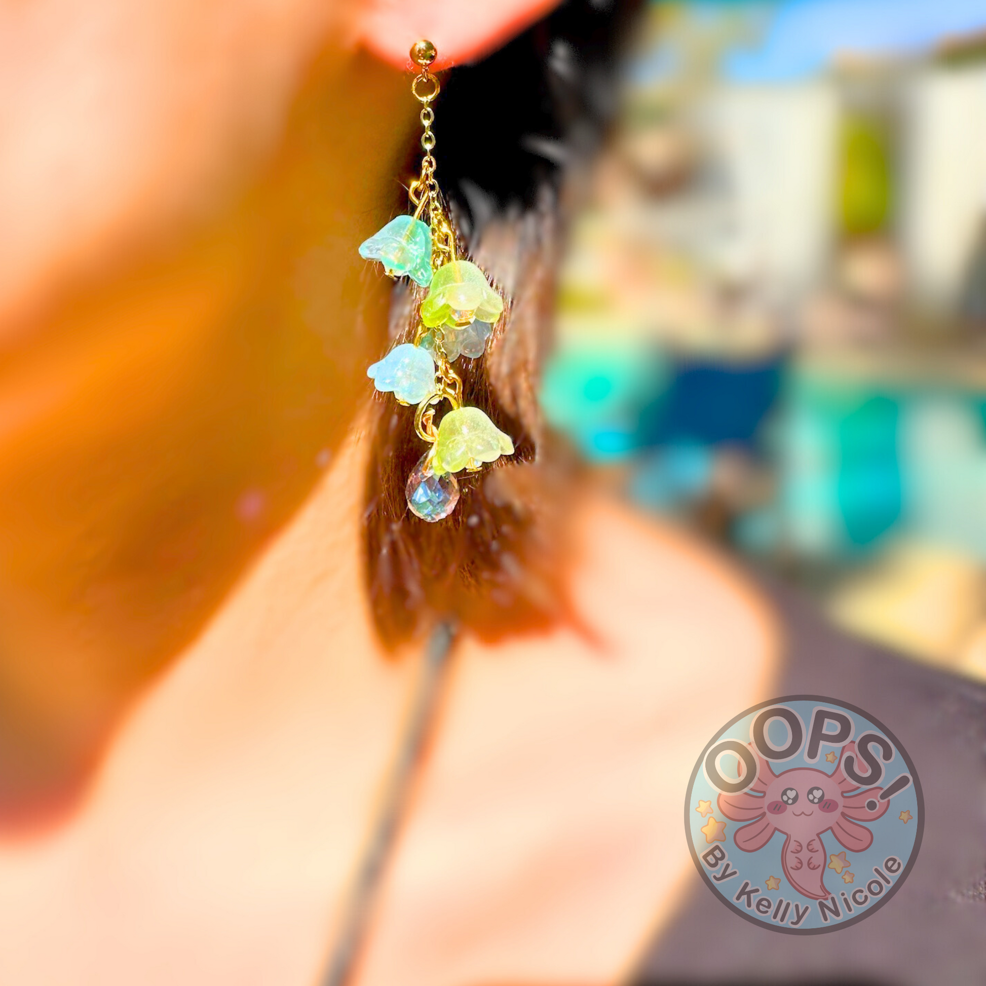 Wisteria Blue Green  Floral Drop Earrings with Crystal dangle. Gold or Silver- Plated.  Lightweight, Hypoallergenic Statement posts. Its  seamlessly transitions from casual outings, Weddings and elegant events. 002 Shop online today to get yours at HTTPS://OOPSBYKELLYNICOLE.COM