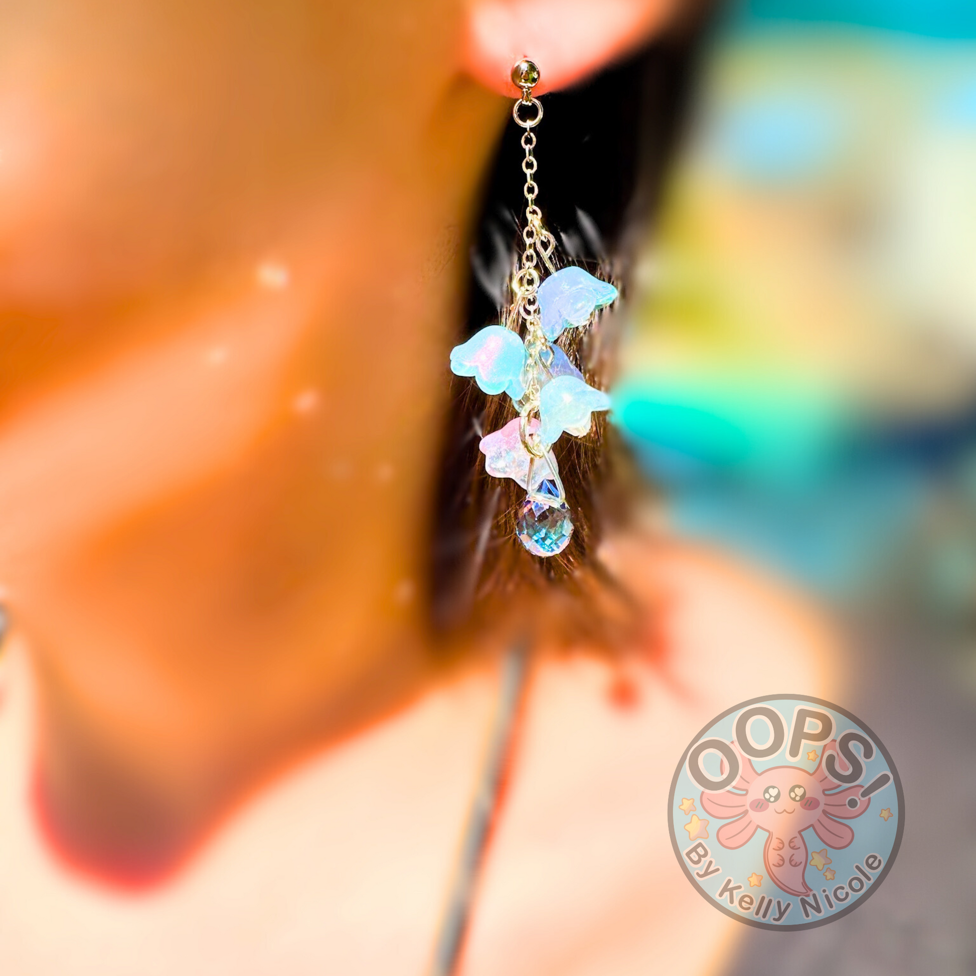 Wisteria Blue Lilac Floral Drop Earrings with Crystal dangle. Gold or Silver- Plated.  Lightweight, Hypoallergenic Statement posts on person. Its  seamlessly transitions from casual outings, Weddings and elegant events. 003 Shop online today to get yours at HTTPS://OOPSBYKELLYNICOLE.COM 