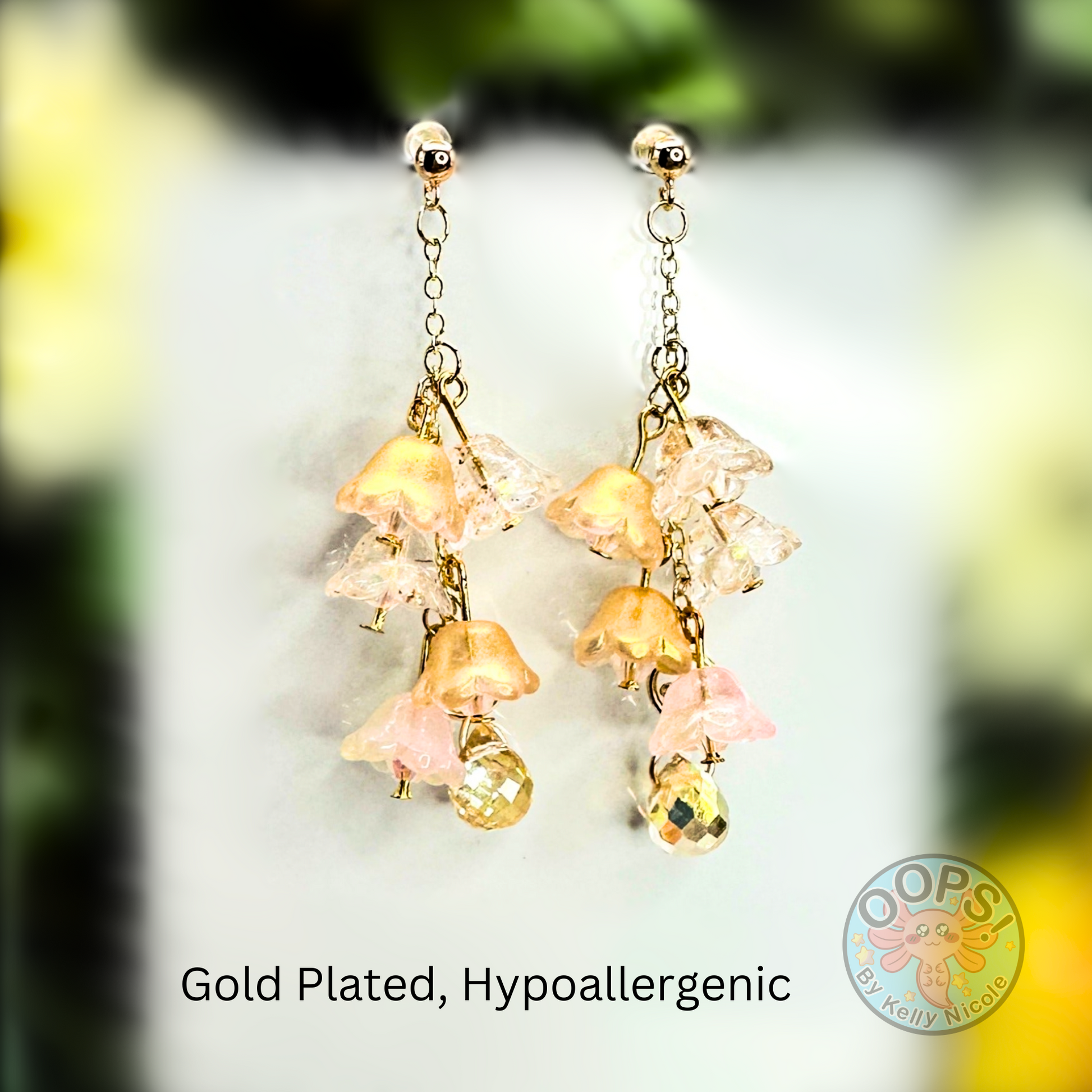 Wisteria Gold Blush  Floral Drop Earrings with Crystal dangle. Gold-Plated.  Lightweight, Hypoallergenic Statement posts. Its  seamlessly transitions from casual outings, Weddings and elegant events. 003 Shop online today to get yours at HTTPS://OOPSBYKELLYNICOLE.COM 