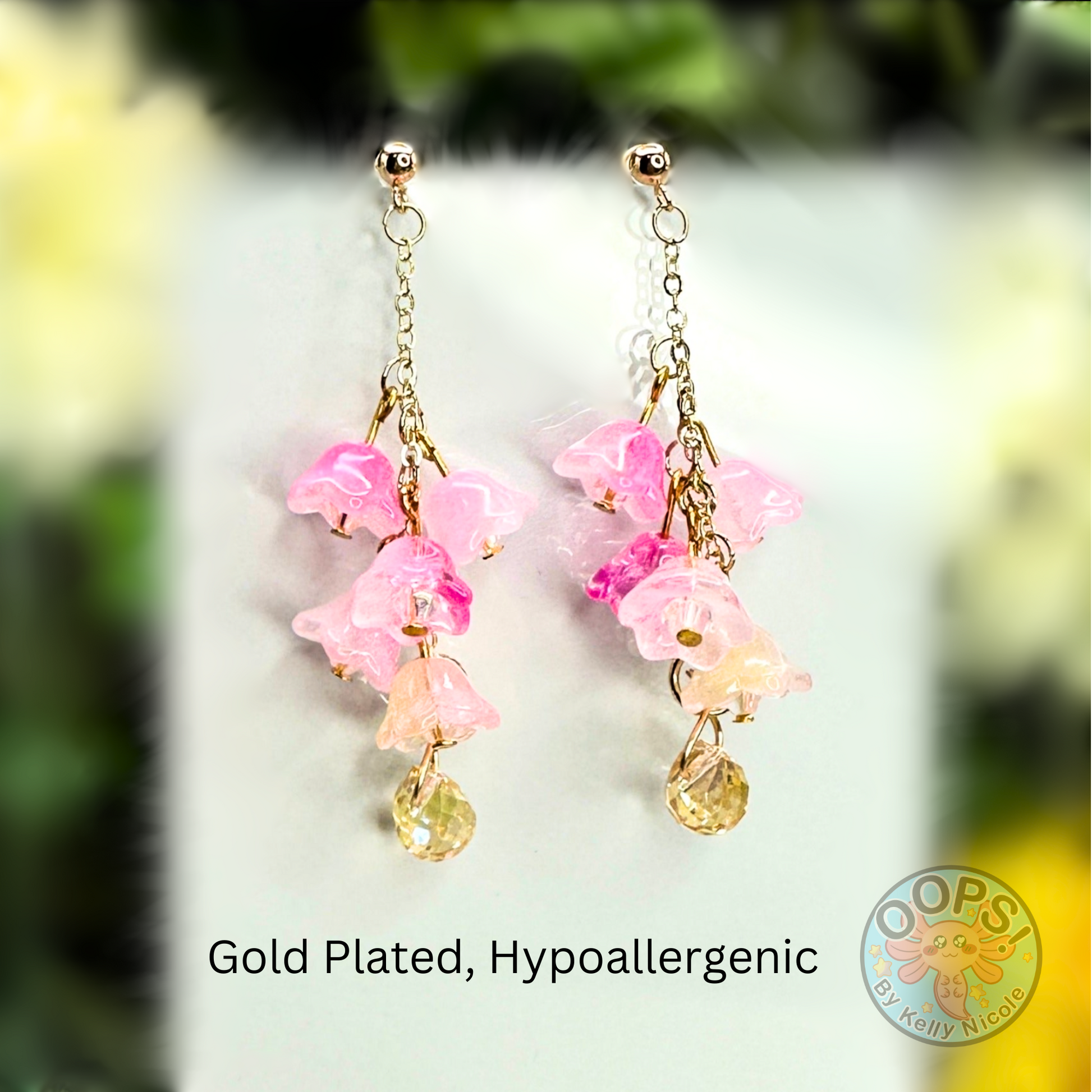 Wisteria Pink Blush  Floral Drop Earrings with Crystal dangle. Gold-Plated.  Lightweight, Hypoallergenic Statement posts. Its  seamlessly transitions from casual outings, Weddings and elegant events. 003 Shop online today to get yours at HTTPS://OOPSBYKELLYNICOLE.COM