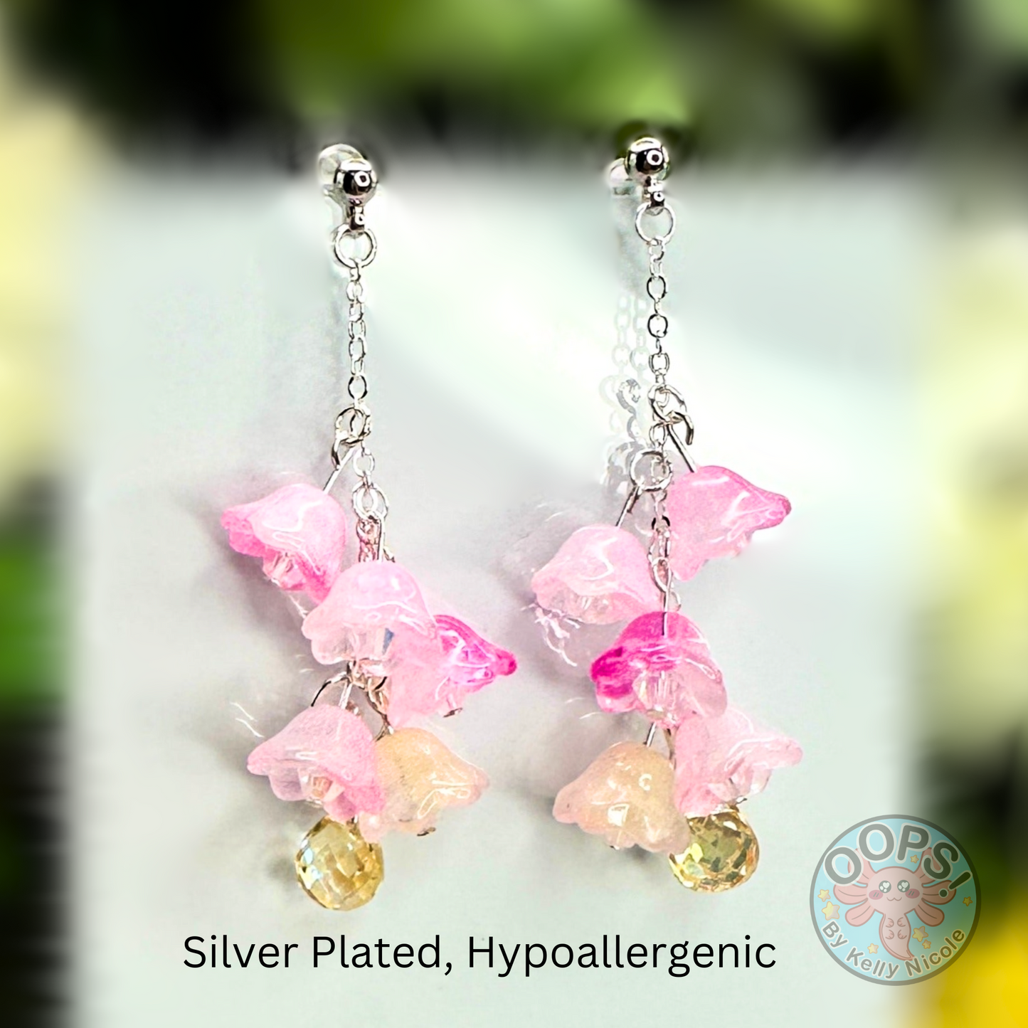 Wisteria Pink Blush  Floral Drop Earrings with Crystal dangle. Silver-Plated.  Lightweight, Hypoallergenic Statement posts. Its  seamlessly transitions from casual outings, Weddings and elegant events. 003 Shop online today to get yours at HTTPS://OOPSBYKELLYNICOLE.COM 