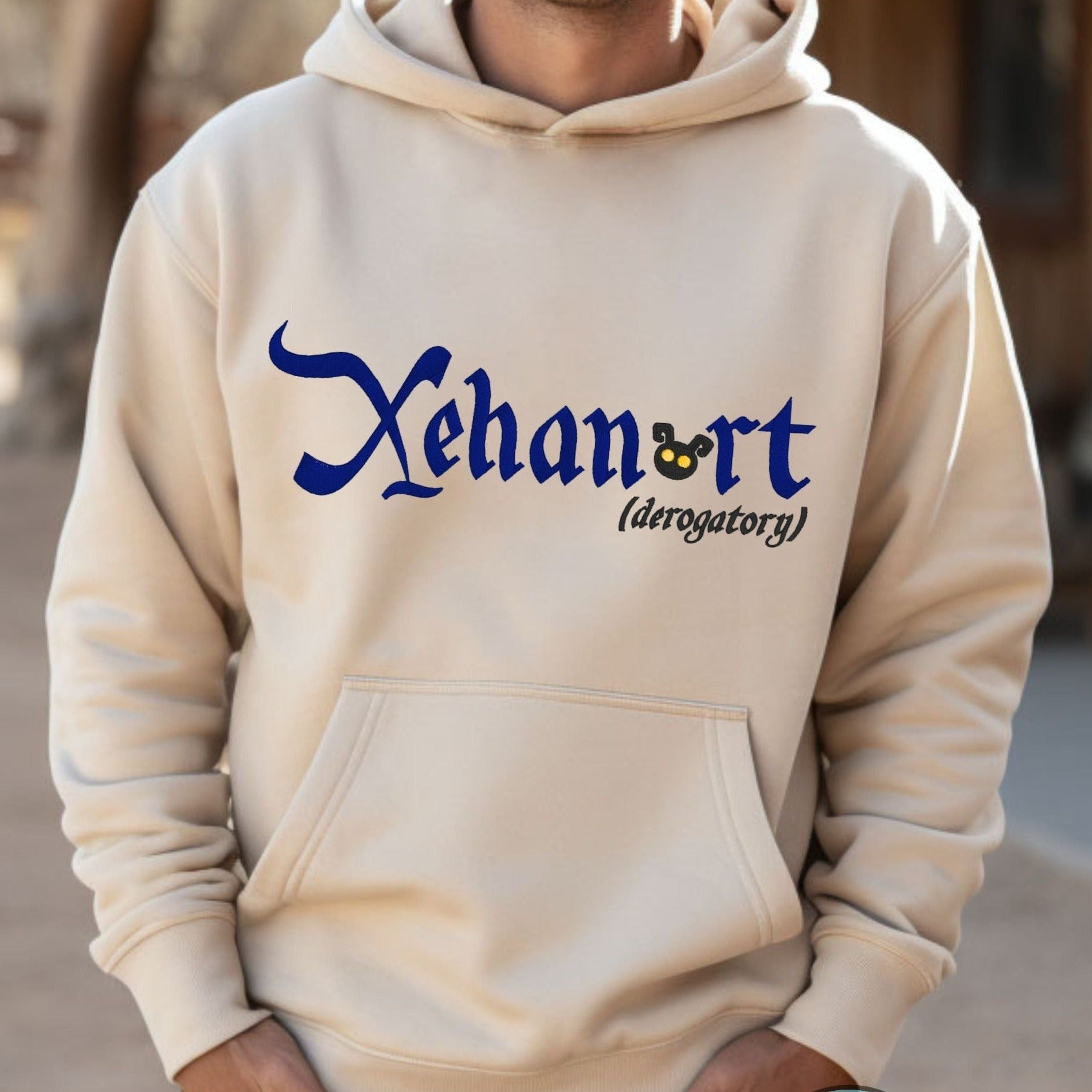 Disney Kingdom Hearts Video Game “XEHANORT (derogatory)” Shirt. Embroidered Heavyweight Unisex Hoodie in Sand . Shop online today to get yours at HTTPS://OOPSBYKELLYNICOLE.COM